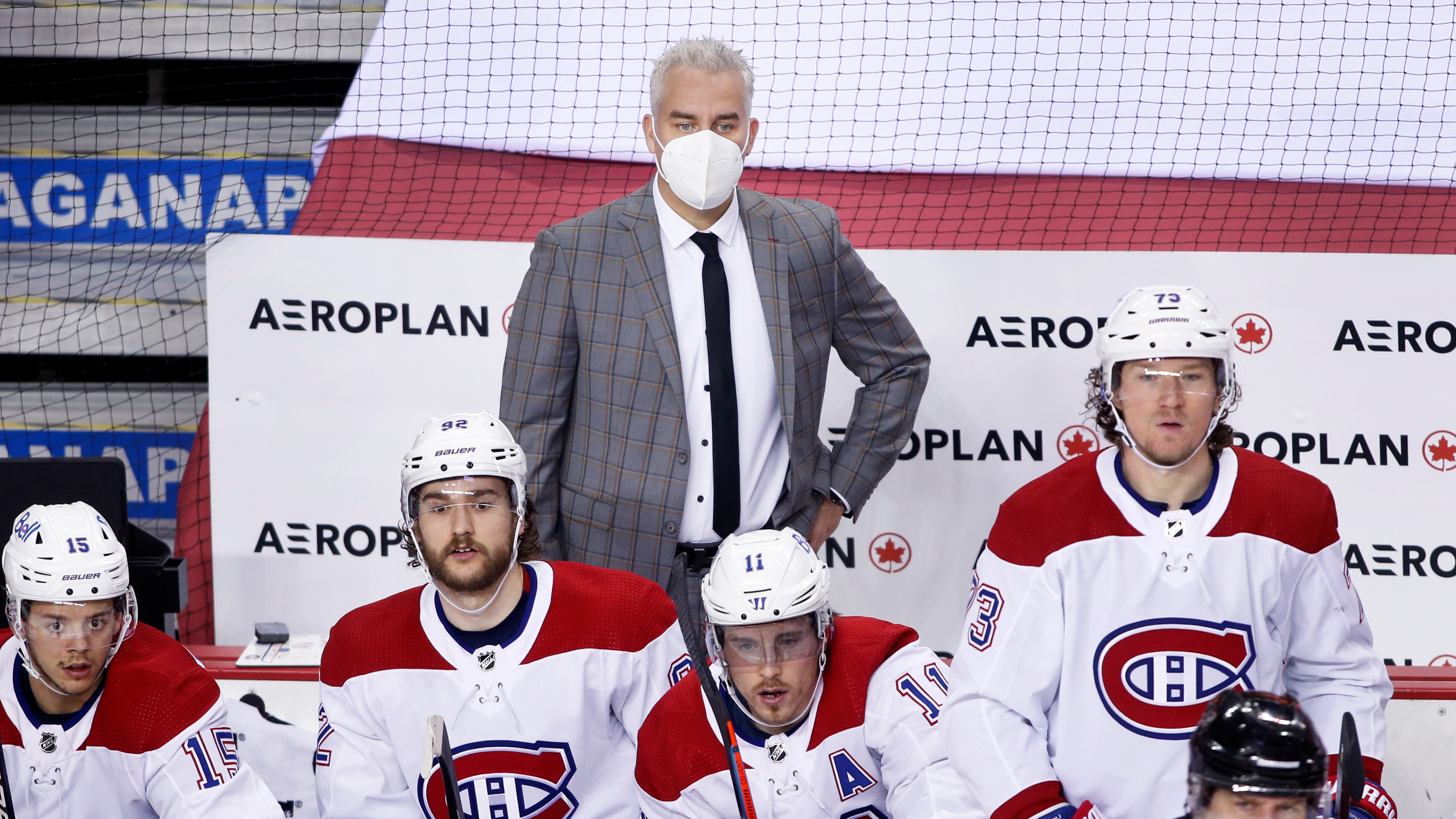 Montreal Canadiens head coach Dominique Ducharme, center, during an NHL hockey game, Thursday, March 11, 2021, in Calgary, Canada. (AP Photo/Larry MacDougal)