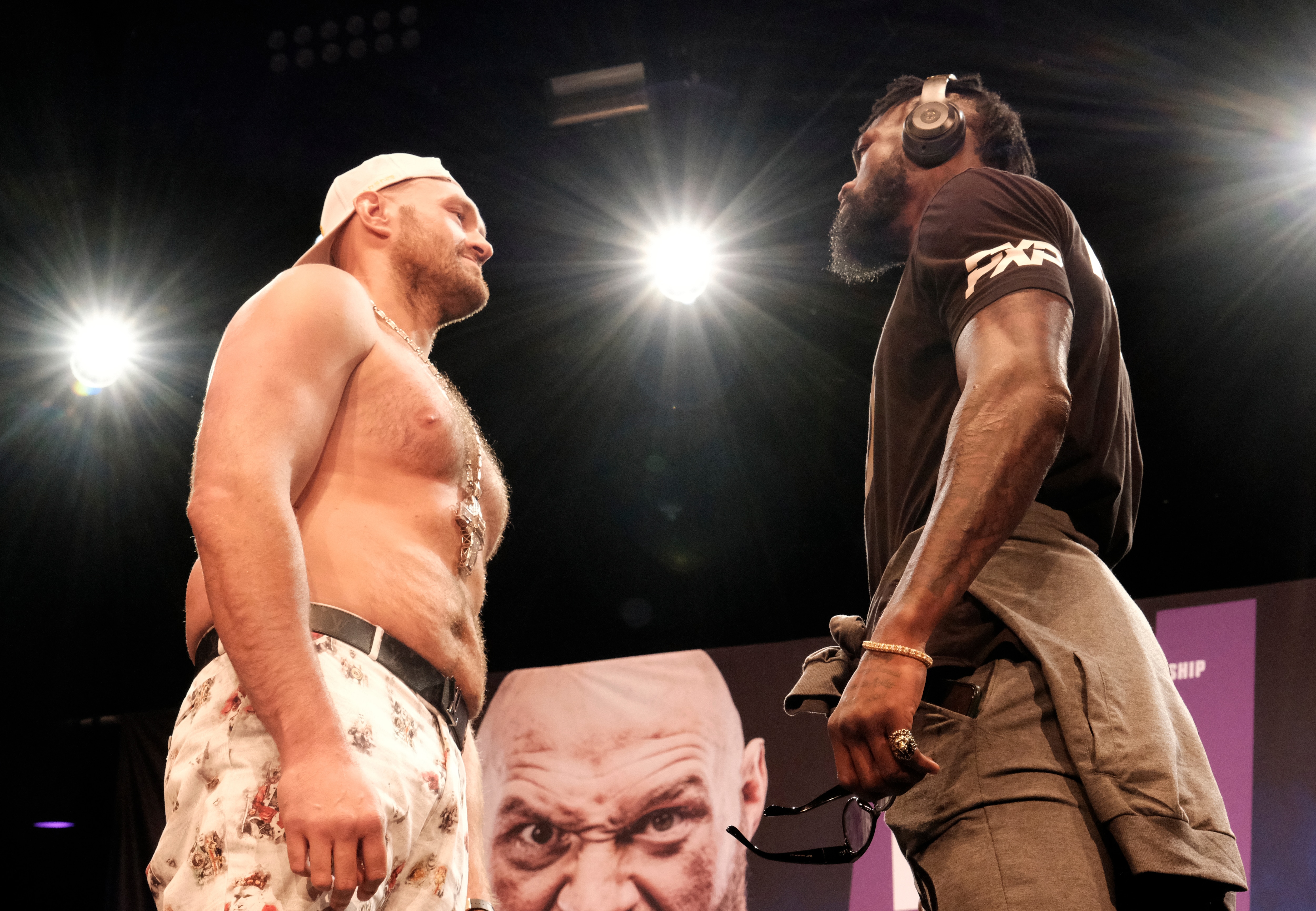 WBC Heavyweight Champion Tyson Fury, left and Deontay Wilder face off at a news conference in Los Angeles on Tuesday, June 15, 2021, In anticipation of their third heavyweight championship showdown. WBC Heavyweight Champion Tyson "The Gypsy King" Fury and former longtime heavyweight champion Deontay "The Bronze Bomber" Wilder went face-to-face at a Los Angeles press conference ahead of their bout scheduled for July 24 in Las Vegas. (AP Photo/Richard Vogel)