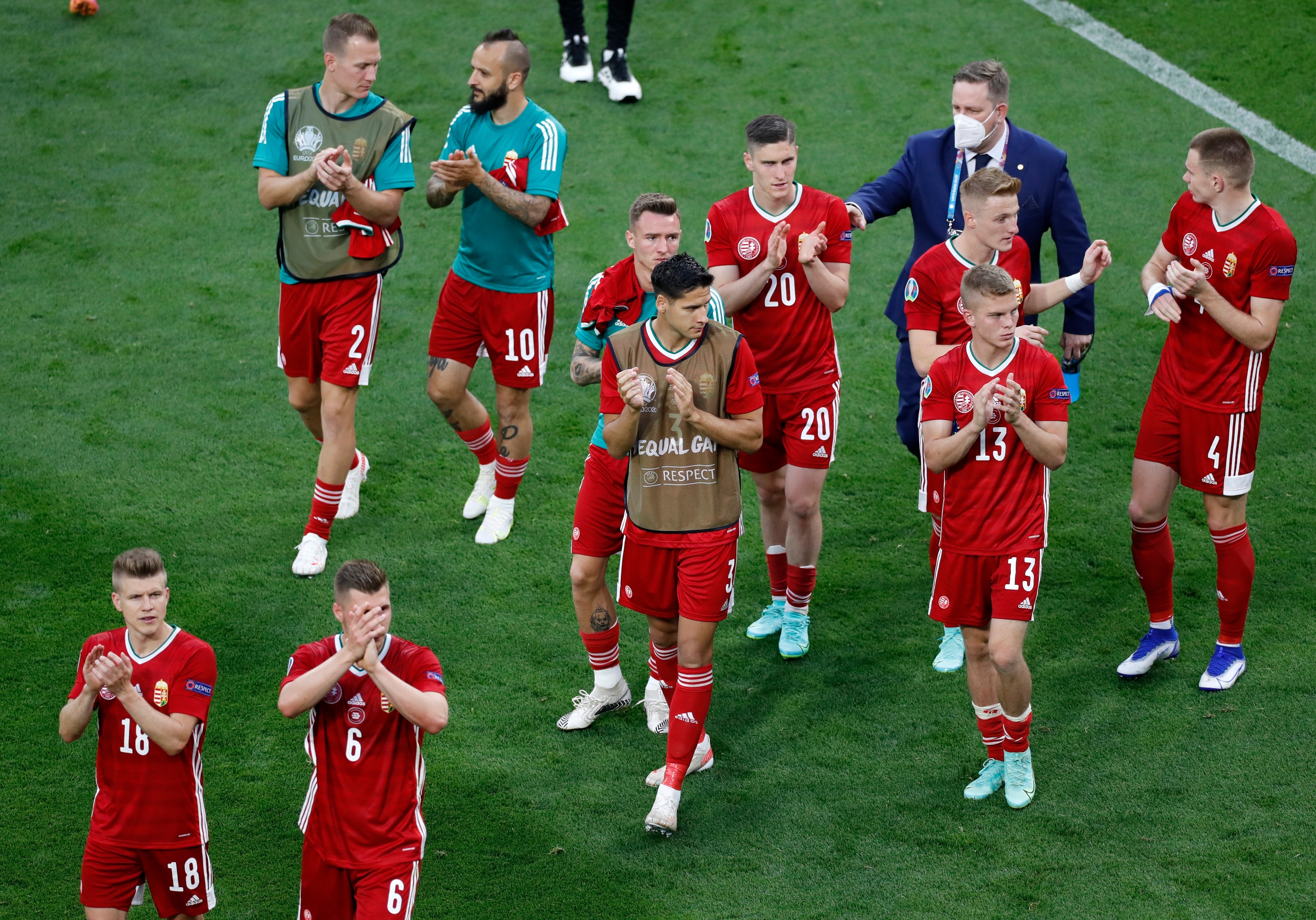 Players of Hungary applaud their fans after the Euro 2020 soccer championship group F match between Hungary and Portugal at the Ferenc Puskas stadium in Budapest, Hungary, Tuesday, June 15, 2021. Portugal won 3-0. (AP Photo/Laszlo Balogh, Pool)