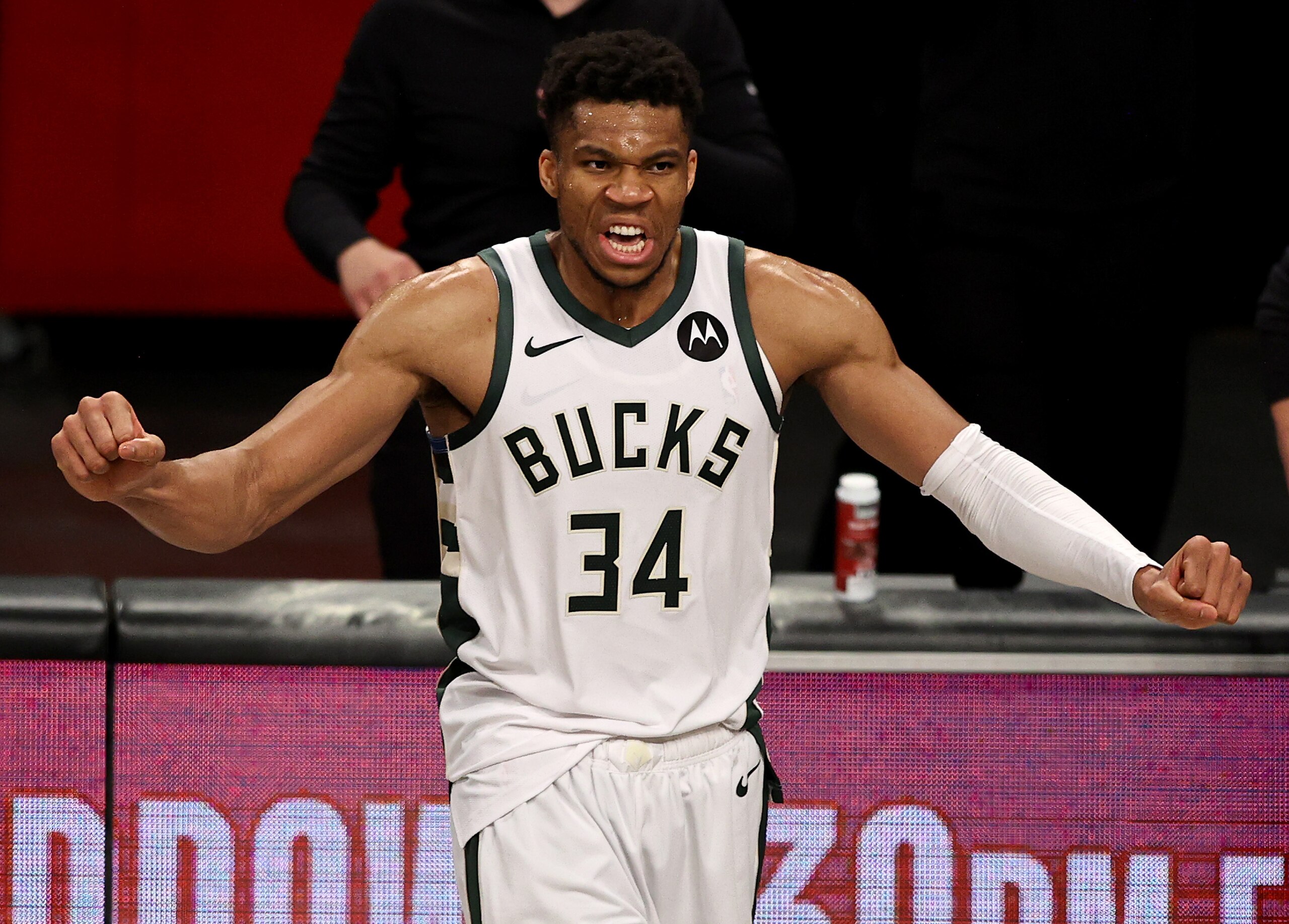 NEW YORK, NEW YORK - JUNE 19: Giannis Antetokounmpo #34 of the Milwaukee Bucks celebrates the win of game seven of the Eastern Conference second round at Barclays Center on June 19, 2021 in the Brooklyn borough of  New York City. The Milwaukee Bucks defeated the Brooklyn Nets 115-111 in overtime to win the series. NOTE TO USER: User expressly acknowledges and agrees that, by downloading and or using this photograph, User is consenting to the terms and conditions of the Getty Images License Agreement. (Photo by Elsa/Getty Images)