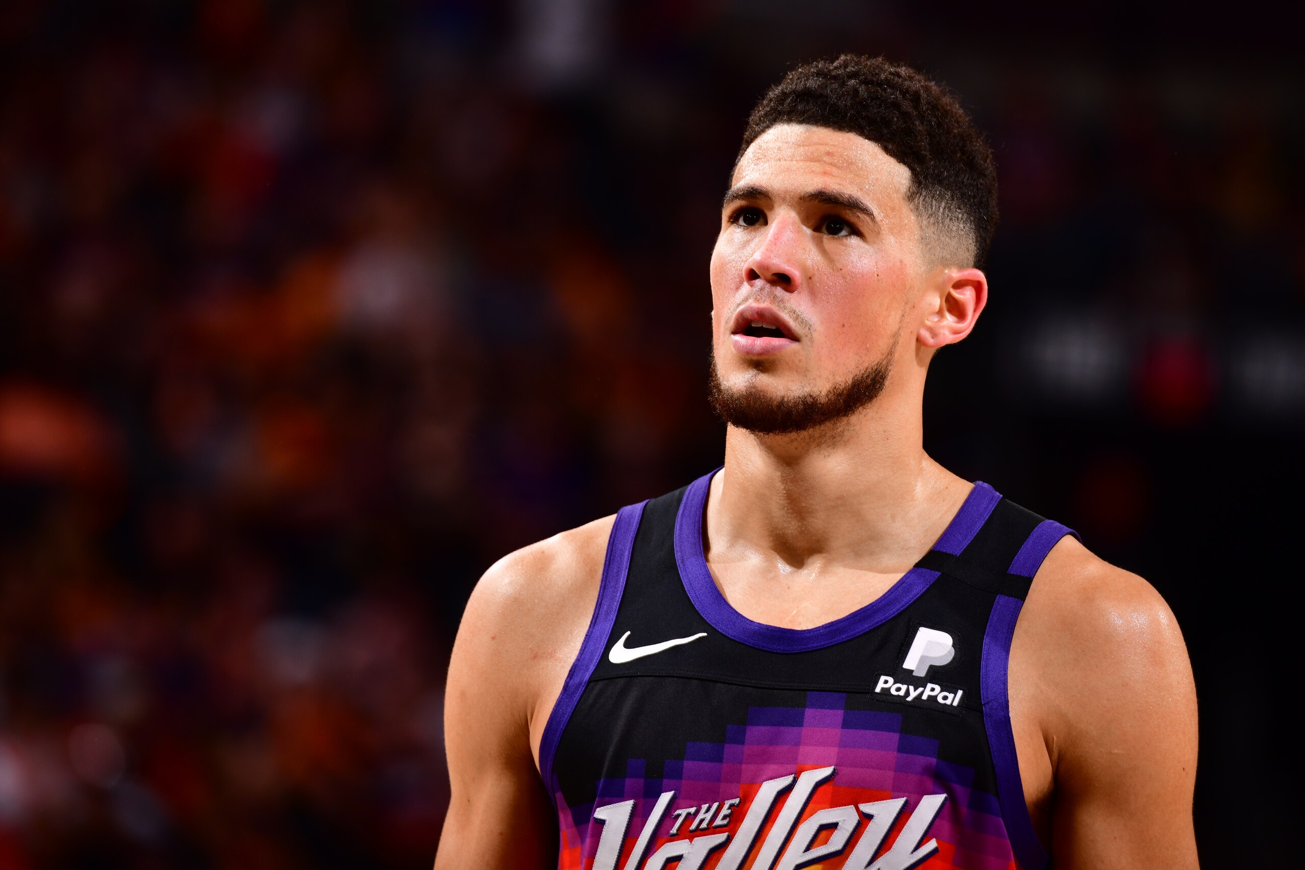 PHOENIX, AZ - JUNE 20: Devin Booker #1 of the Phoenix Suns looks on during the game against the LA Clippers during Game 1 of the Western Conference Finals of the 2021 NBA Playoffs on June 20, 2021 at Phoenix Suns Arena in Phoenix, Arizona. NOTE TO USER: User expressly acknowledges and agrees that, by downloading and or using this photograph, user is consenting to the terms and conditions of the Getty Images License Agreement. Mandatory Copyright Notice: Copyright 2021 NBAE (Photo by Barry Gossage/NBAE via Getty Images)