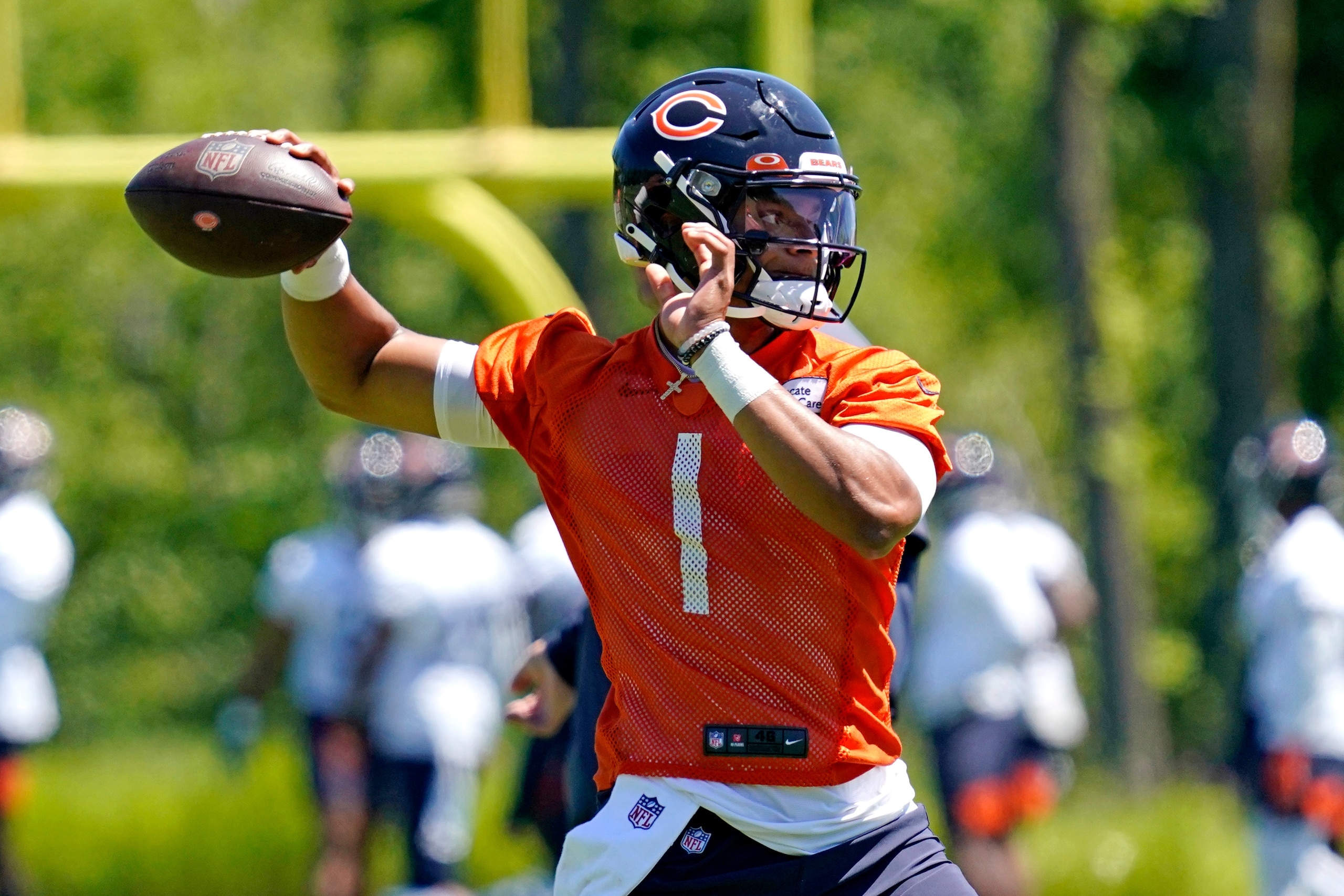 Chicago Bears quarterback Justin Fields throws during NFL football practice in Lake Forest, Ill., Wednesday, June 16, 2021. (AP Photo/Nam Y. Huh)