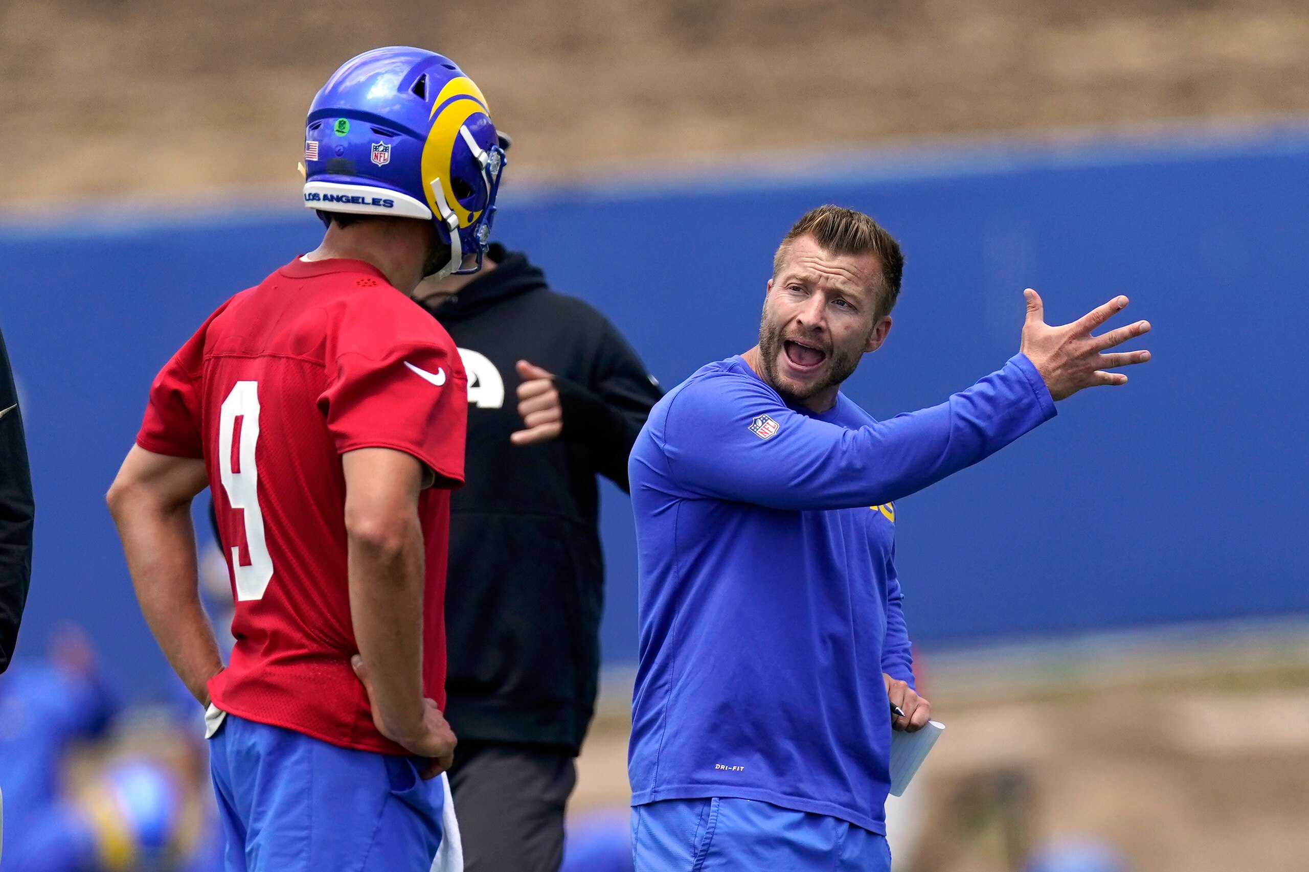 Los Angeles Rams head coach Sean McVay, right, talks to quarterback Matthew Stafford during an NFL football practice Tuesday, June 8, 2021, in Thousand Oaks, Calif. (AP Photo/Mark J. Terrill)