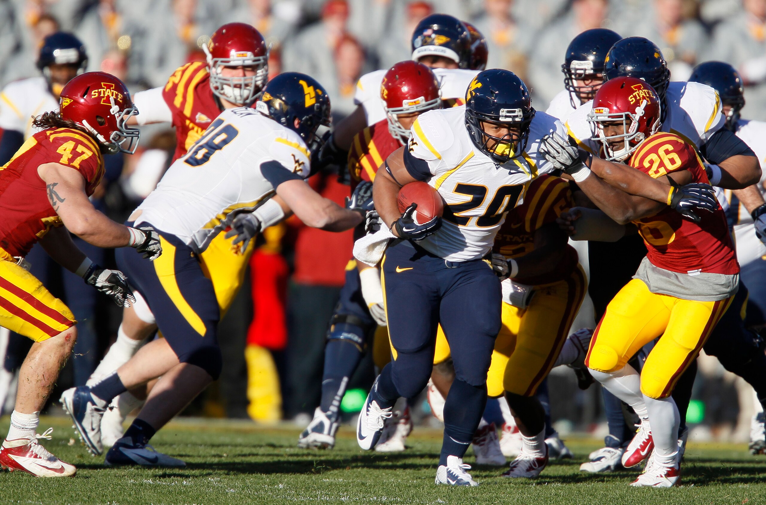 Iowa State defensive back Deon Broomfield (26) chases down West Virginia running back Shawne Alston (20) during the first half of an NCAA college football game on Friday, Nov. 23, 2012, in Ames, Iowa. (AP Photo/Matthew Putney) Iowa State defensive back Deon Broomfield (26) chases down West Virginia running back Shawne Alston (20) during the first half of an NCAA college football game on Friday, Nov. 23, 2012, in Ames, Iowa. (AP Photo/Matthew Putney)
