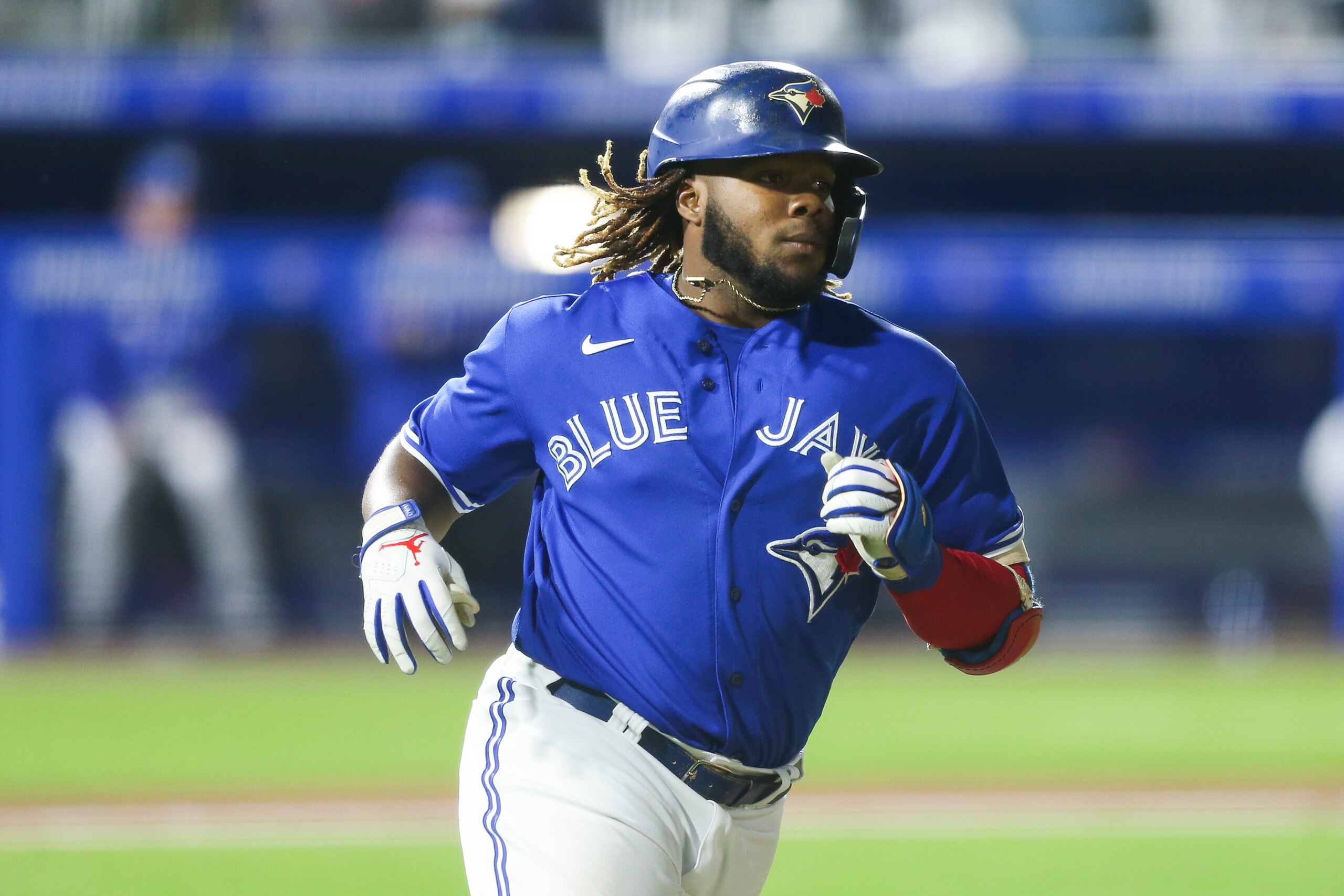 BUFFALO, NEW YORK - JUNE 16: Vladimir Guerrero Jr. #27 of the Toronto Blue Jays runs to first as he hits a single during the ninth inning against the New York Yankees at Sahlen Field on June 16, 2021 in Buffalo, New York. (Photo by Joshua Bessex/Getty Images)