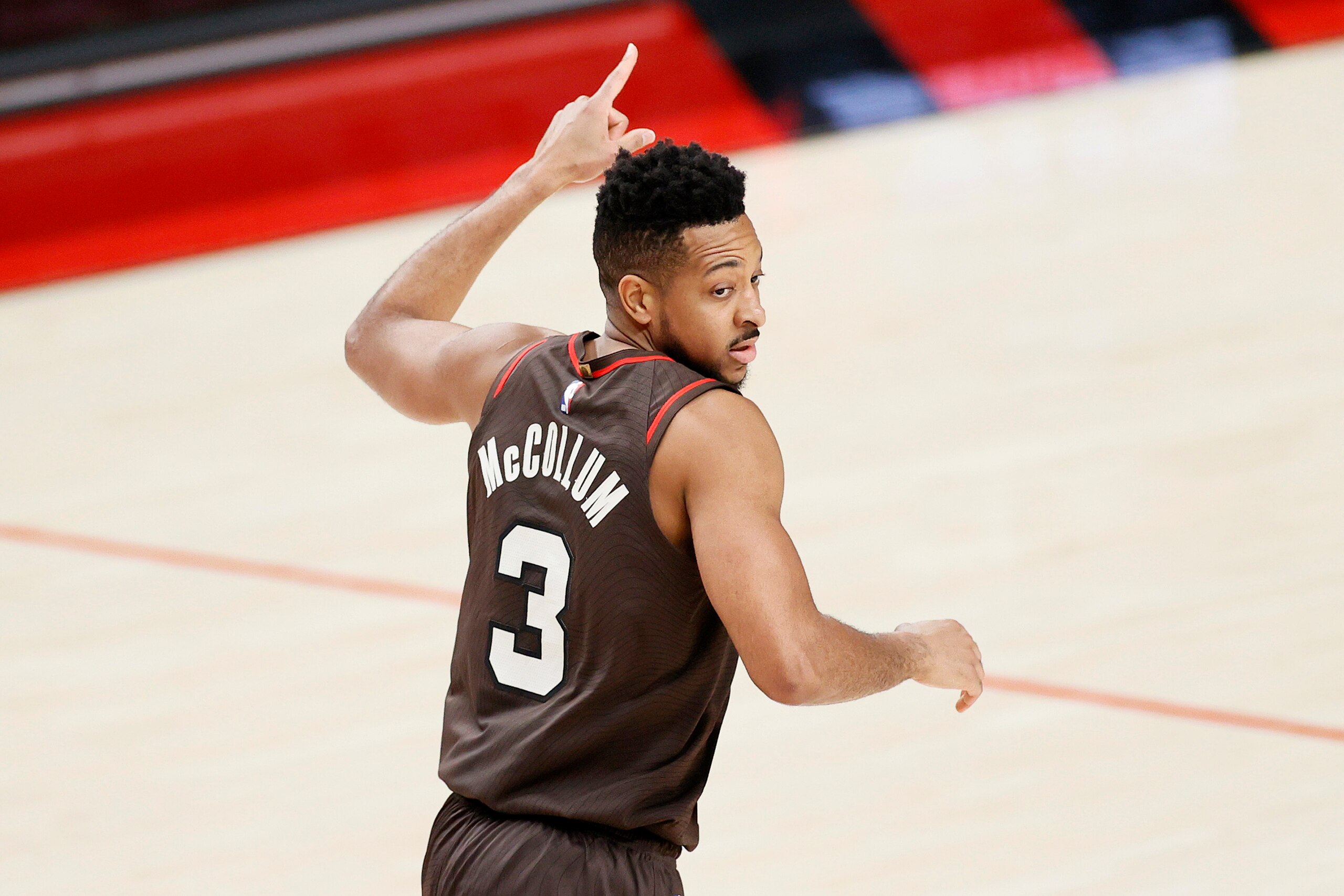 PORTLAND, OREGON - JUNE 03: CJ McCollum #3 of the Portland Trail Blazers reacts after a basket against the Denver Nuggets during Round 1, Game 6 of the 2021 NBA Playoffs at Moda Center on June 03, 2021 in Portland, Oregon. NOTE TO USER: User expressly acknowledges and agrees that, by downloading and or using this photograph, User is consenting to the terms and conditions of the Getty Images License Agreement. (Photo by Steph Chambers/Getty Images)