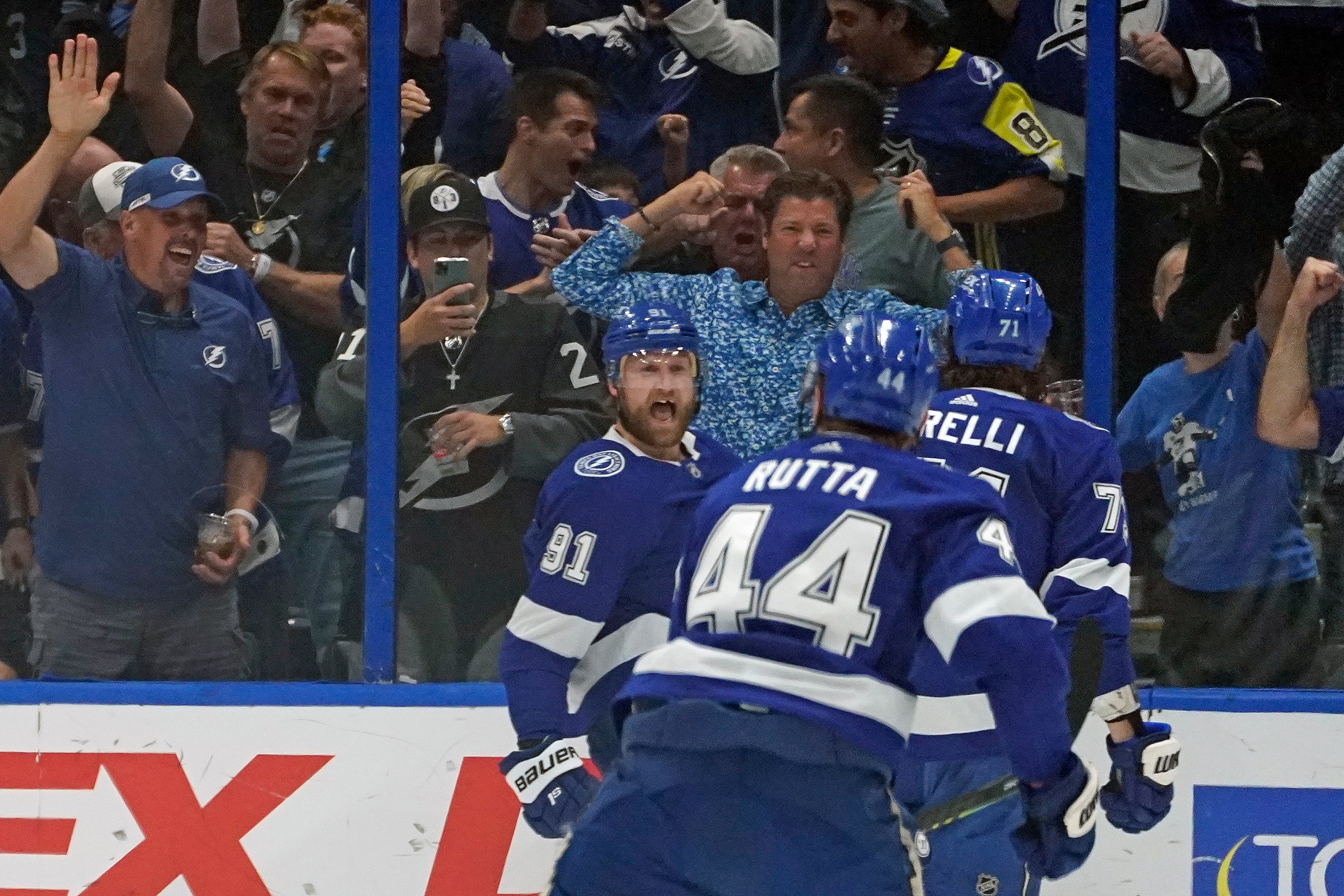 Tampa Bay Lightning center Steven Stamkos (91) celebrates after scoring a goal against the New York Islanders with teammates defenseman Jan Rutta (44) and center Anthony Cirelli (71) during the first period in Game 5 of an NHL hockey Stanley Cup semifinal playoff series Monday, June 21, 2021, in Tampa, Fla. (AP Photo/Chris O'Meara)