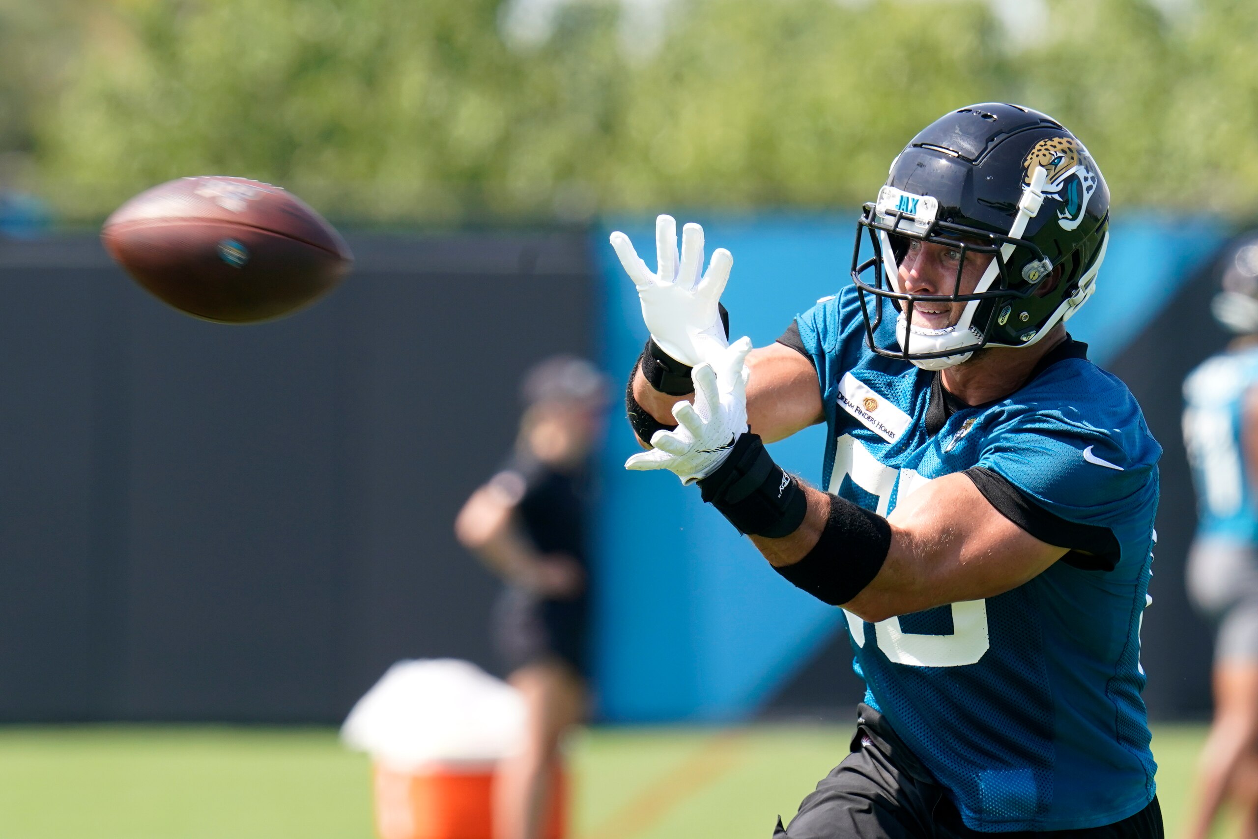 Jacksonville Jaguars tight end Tim Tebow catches a pass during an NFL football practice, Tuesday, June 15, 2021, in Jacksonville, Fla. (AP Photo/John Raoux)