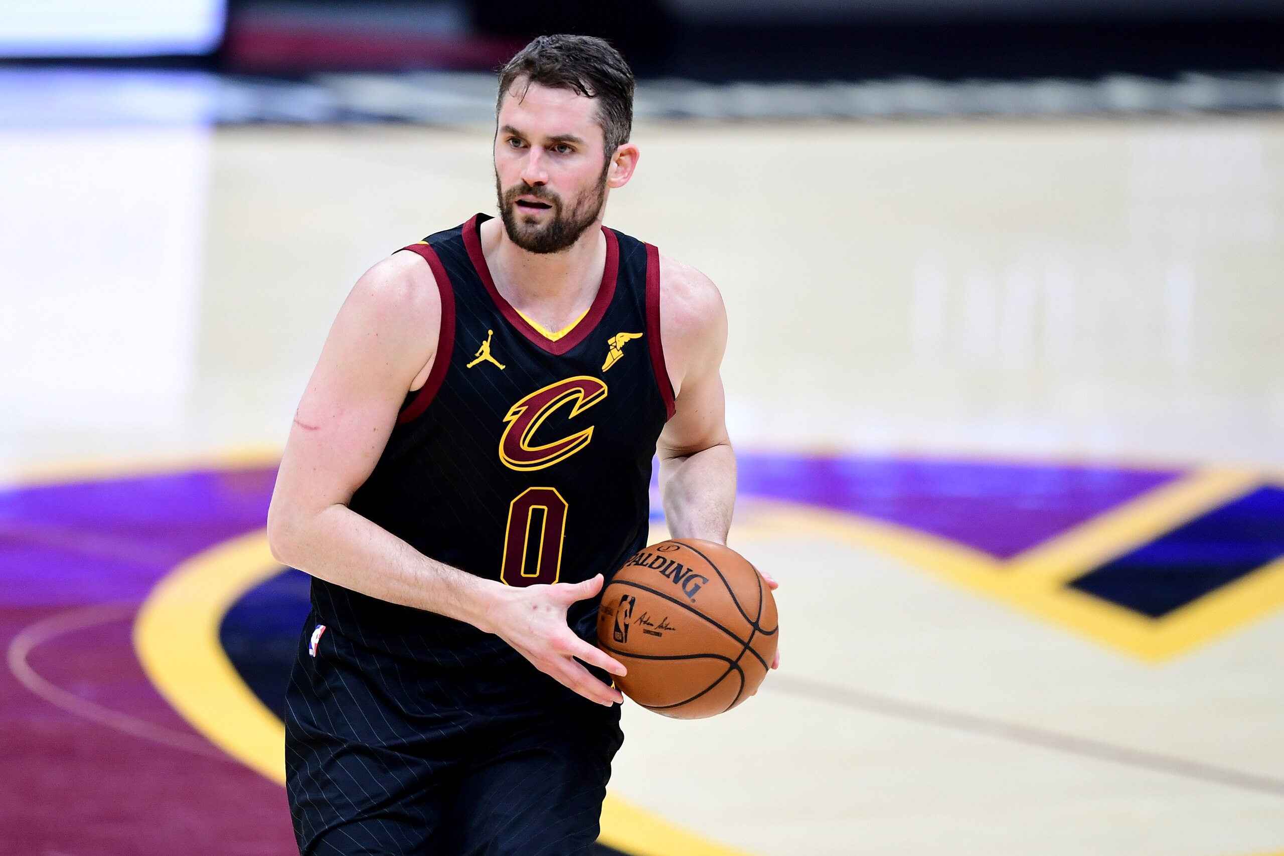 CLEVELAND, OHIO - MAY 12: Kevin Love #0 of the Cleveland Cavaliers drives the ball against the Boston Celtics during their game at Rocket Mortgage Fieldhouse on May 12, 2021 in Cleveland, Ohio. The Cleveland Cavaliers won 102-94. NOTE TO USER: User expressly acknowledges and agrees that, by downloading and or using this photograph, User is consenting to the terms and conditions of the Getty Images License Agreement. (Photo by Emilee Chinn/Getty Images)
