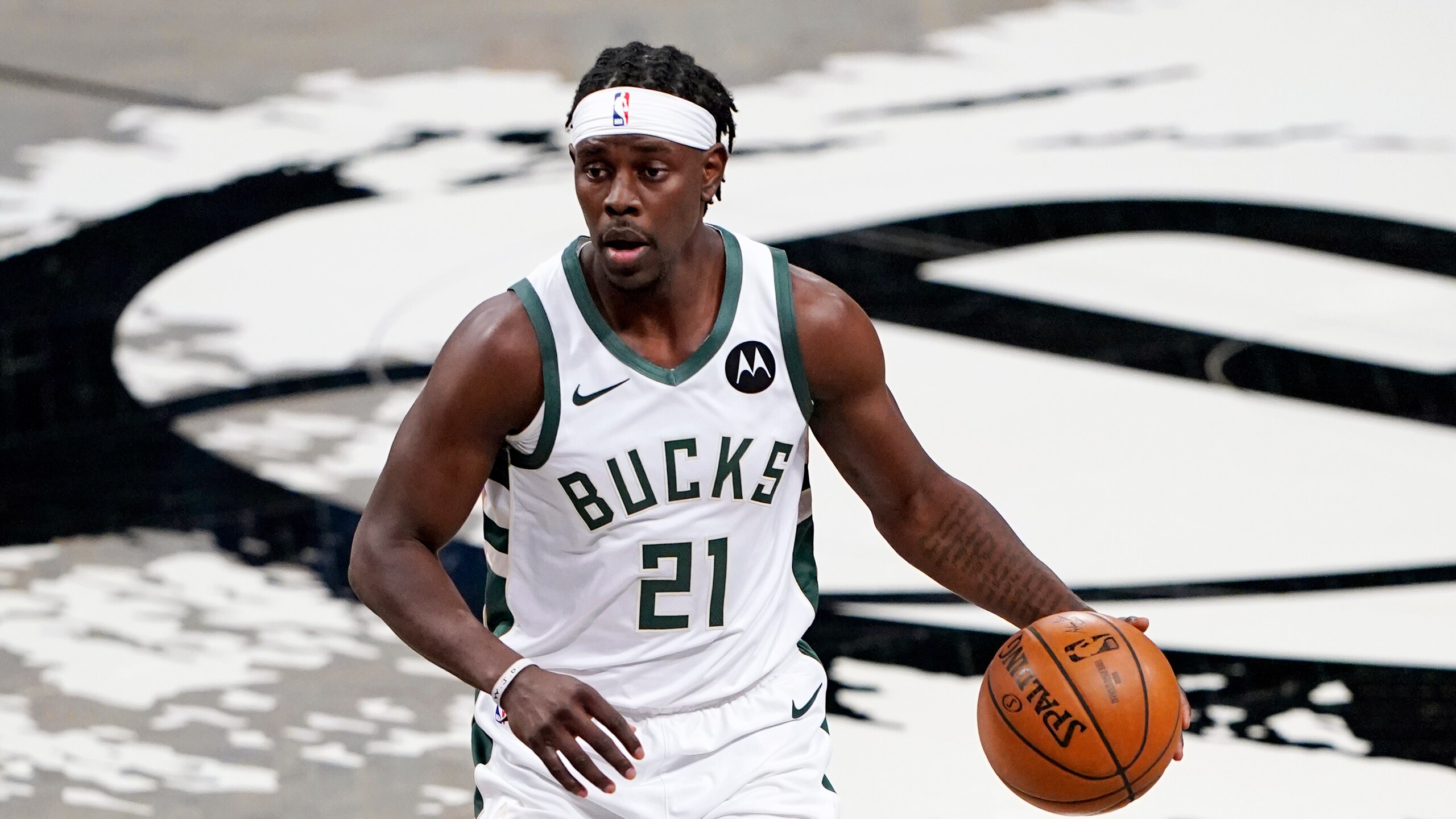 Milwaukee Bucks guard Jrue Holiday (21) looks for an opening in Game 5 of a second-round NBA basketball playoff series against the Brooklyn Nets, Tuesday, June 15, 2021, in New York. (AP Photo/Kathy Willens) Milwaukee Bucks guard Jrue Holiday (21) looks for an opening in Game 5 of a second-round NBA basketball playoff series against the Brooklyn Nets, Tuesday, June 15, 2021, in New York. (AP Photo/Kathy Willens)