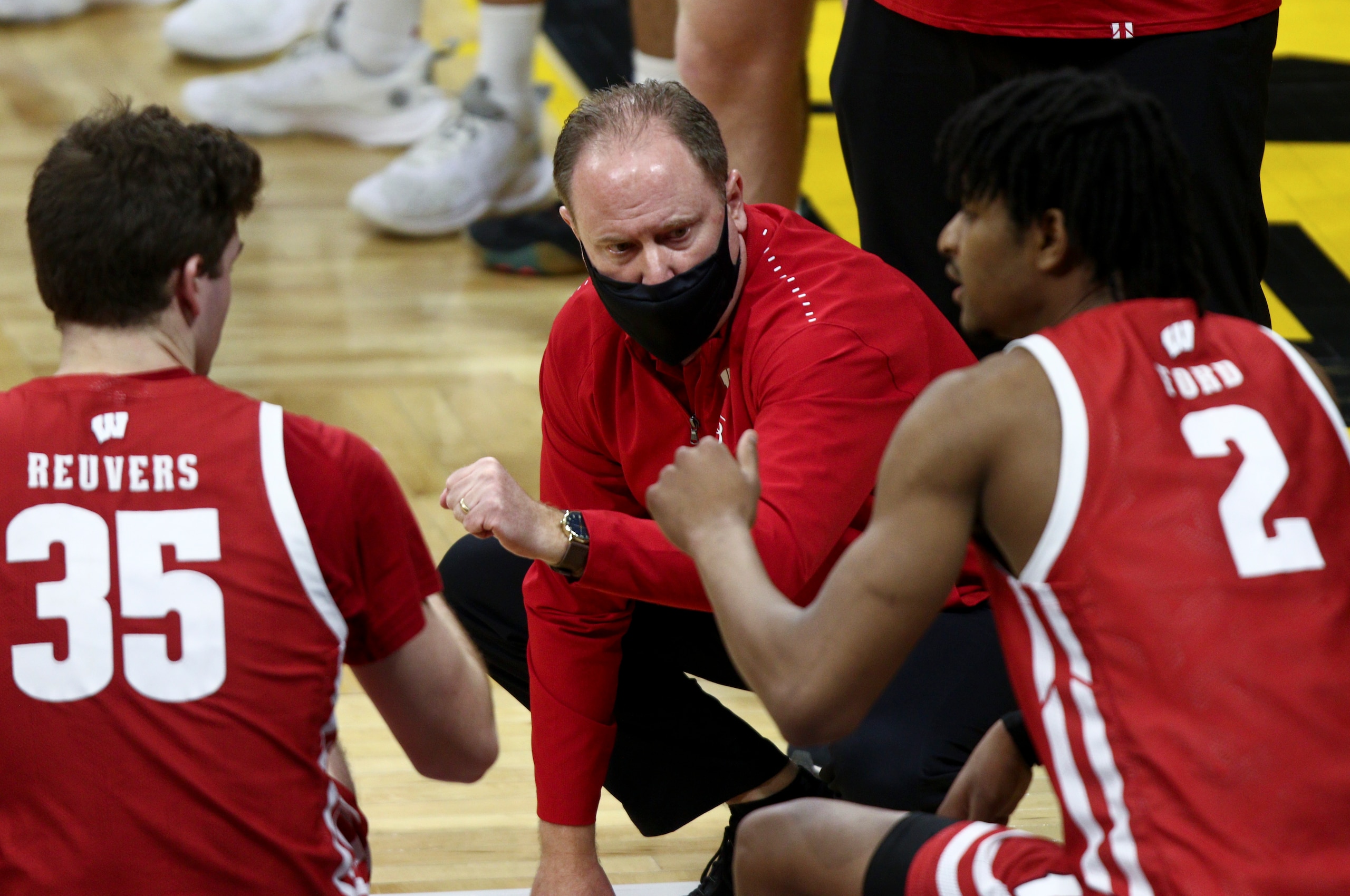 IOWA CITY, IOWA- MARCH 7: Head coach Greg Gard of the Wisconsin Badgers with forward Aleem Ford #2 and forward Nate Reuvers #35 before the match-up against the Iowa Hawkeyes at Carver-Hawkeye Arena on March 7, 2021 in Iowa City, Iowa. (Photo by Matthew Holst/Getty Images) IOWA CITY, IOWA- MARCH 7: Head coach Greg Gard of the Wisconsin Badgers with forward Aleem Ford #2 and forward Nate Reuvers #35 before the match-up against the Iowa Hawkeyes at Carver-Hawkeye Arena on March 7, 2021 in Iowa City, Iowa. (Photo by Matthew Holst/Getty Images)