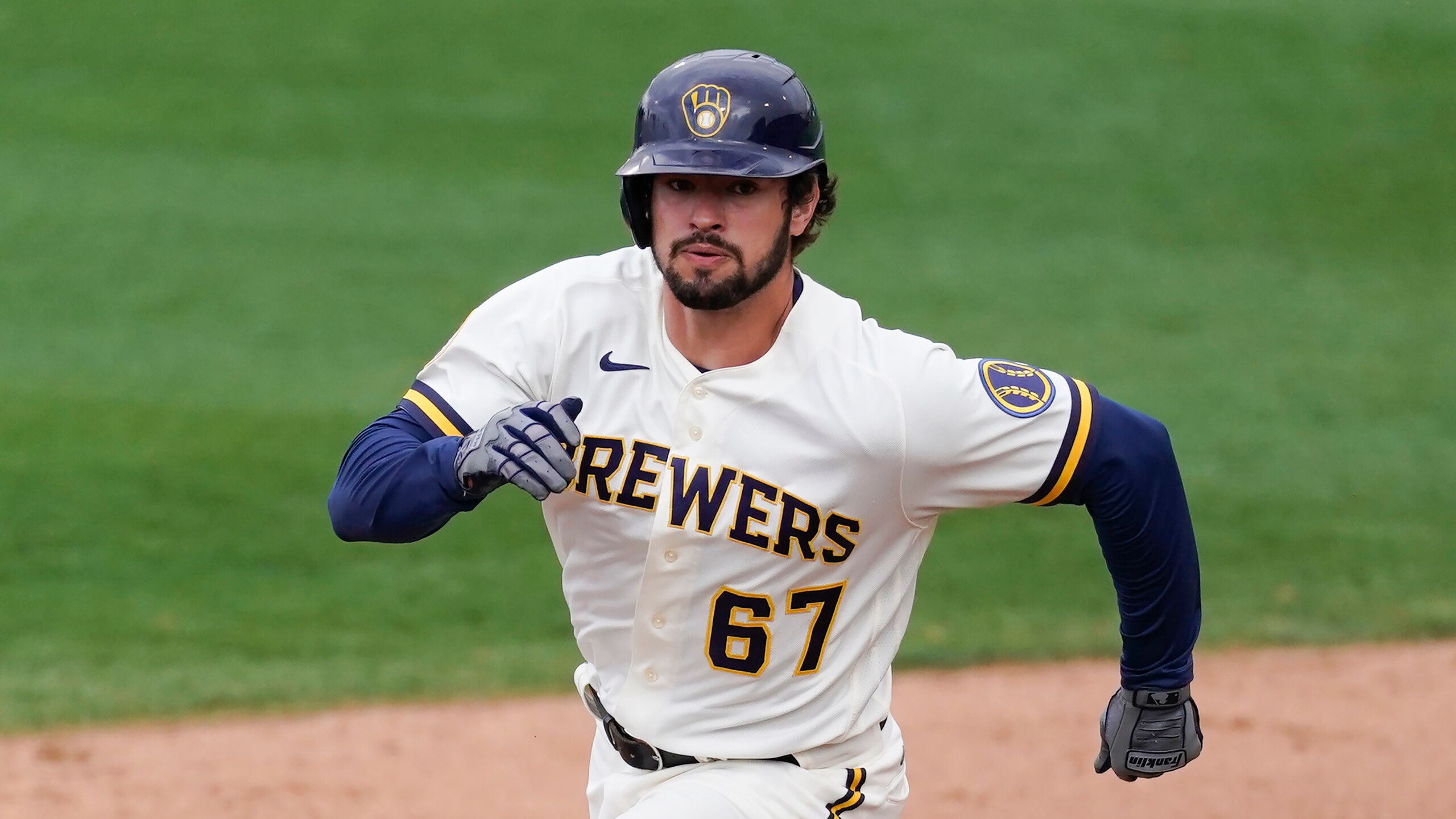 Milwaukee Brewers' Dylan Cozens (67) rounds second base during a spring training baseball game against the Los Angeles Dodgers Tuesday, March 23, 2021, in Phoenix, Ariz. (AP Photo/Ashley Landis)
