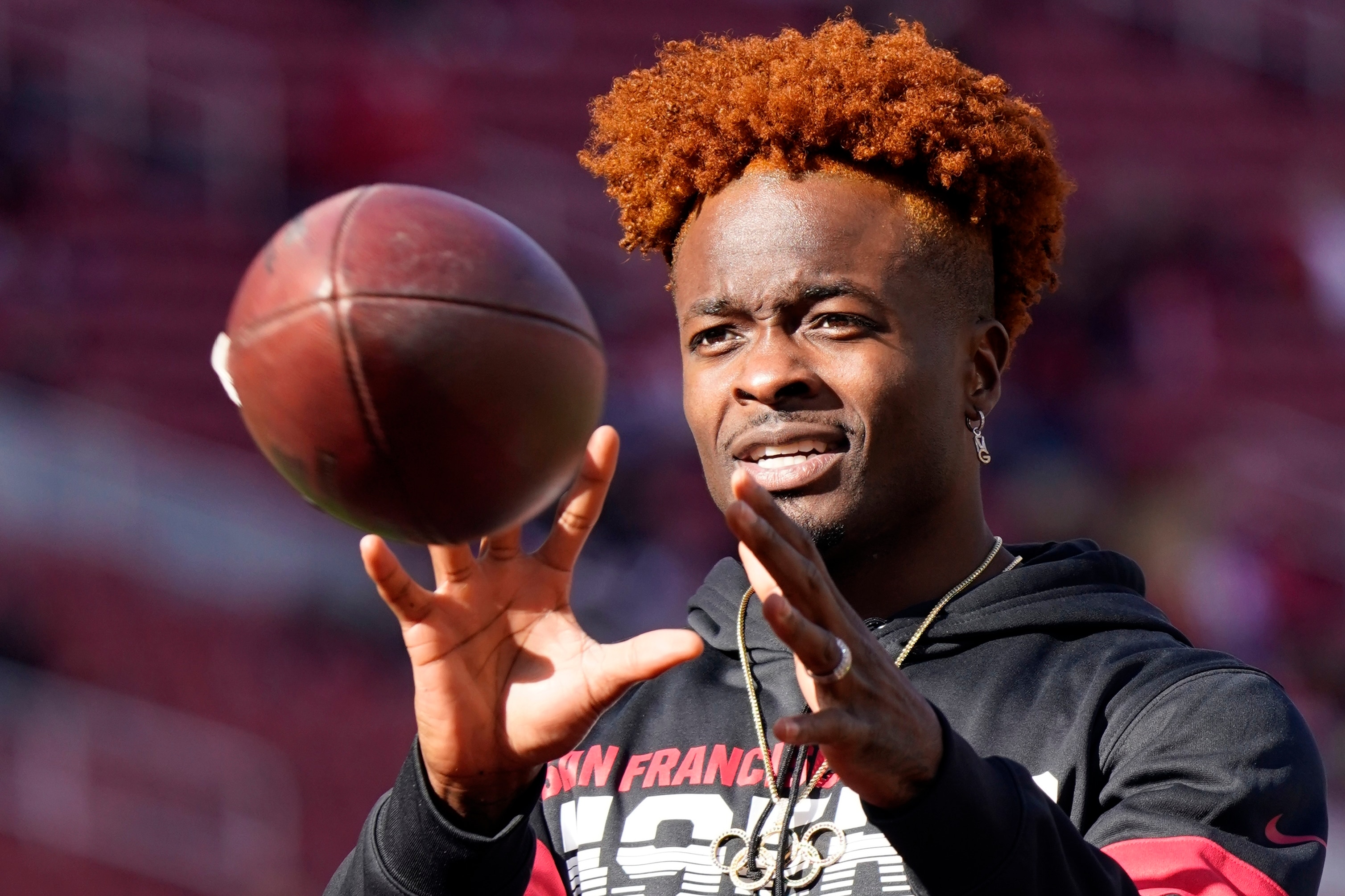 FILE - In this Jan. 11, 2020, file photo San Francisco 49ers wide receiver Marquise Goodwin warms up before an NFL divisional playoff football game against the Minnesota Vikings in Santa Clara, Calif. Goodwin, who signed with the Philadelphia Eagles this off season, is opting out of the upcoming season because of the coronavirus. (AP Photo/Tony Avelar, File)