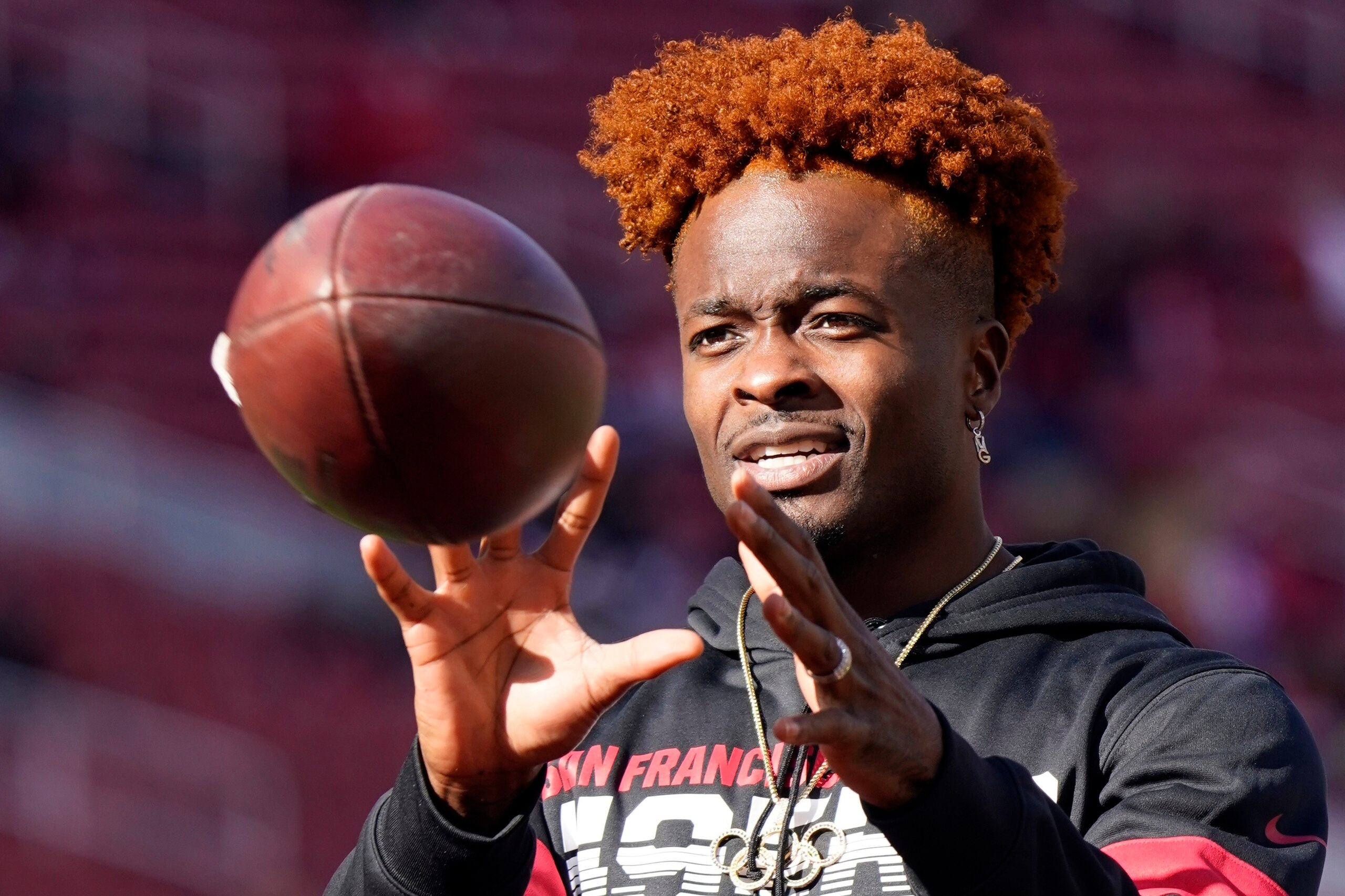 FILE - In this Jan. 11, 2020, file photo San Francisco 49ers wide receiver Marquise Goodwin warms up before an NFL divisional playoff football game against the Minnesota Vikings in Santa Clara, Calif. Goodwin, who signed with the Philadelphia Eagles this off season, is opting out of the upcoming season because of the coronavirus. (AP Photo/Tony Avelar, File)