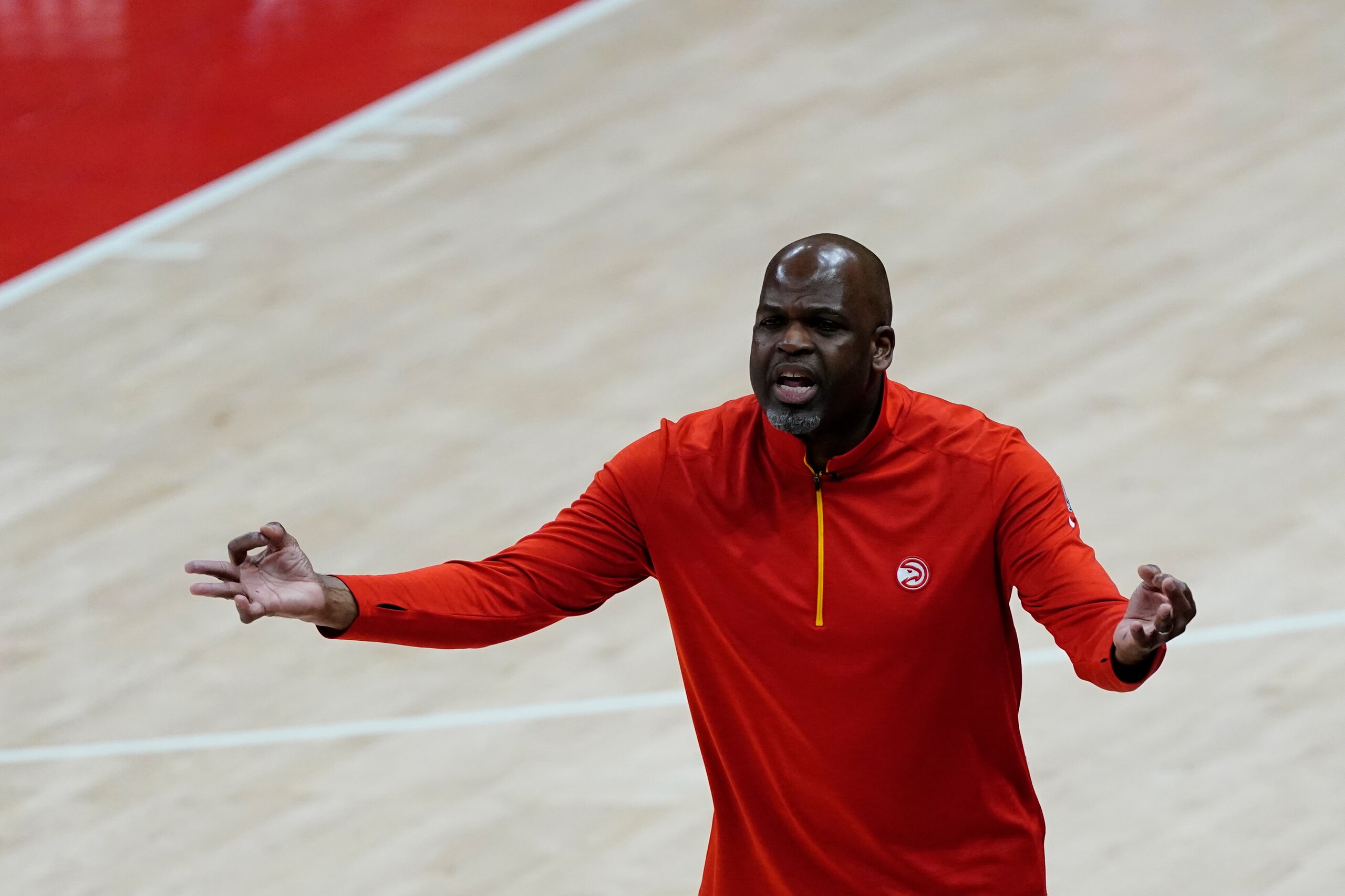 Atlanta Hawks interim head coach Nate McMillan reactsduring the first half of Game 3 of a second-round NBA basketball playoff series, Friday, June 11, 2021, in Atlanta. (AP Photo/John Bazemore)