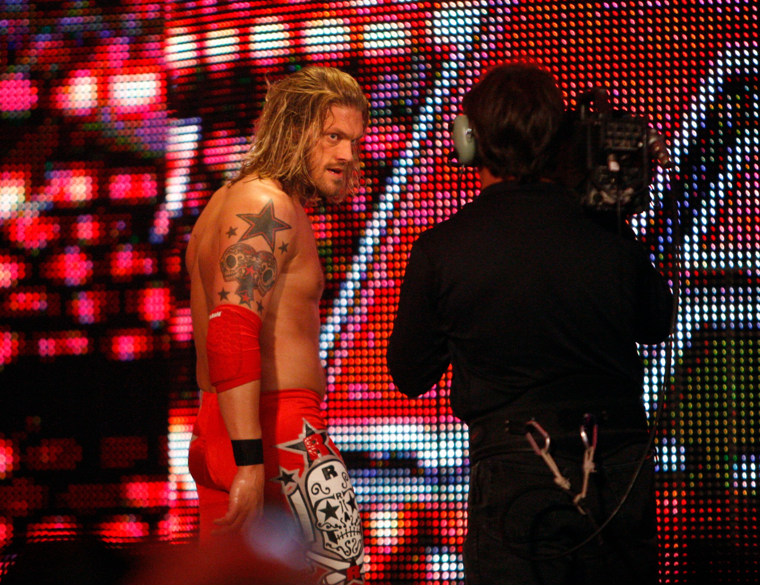 Canadian professional wrestler Edge peers into a live video feed as he taunts his opponent during the Monday Night Raw event at the Staples Center. (Photo by Allen J. Schaben/Los Angeles Times via Getty Images) Canadian professional wrestler Edge peers into a live video feed as he taunts his opponent during the Monday Night Raw event at the Staples Center. (Photo by Allen J. Schaben/Los Angeles Times via Getty Images)