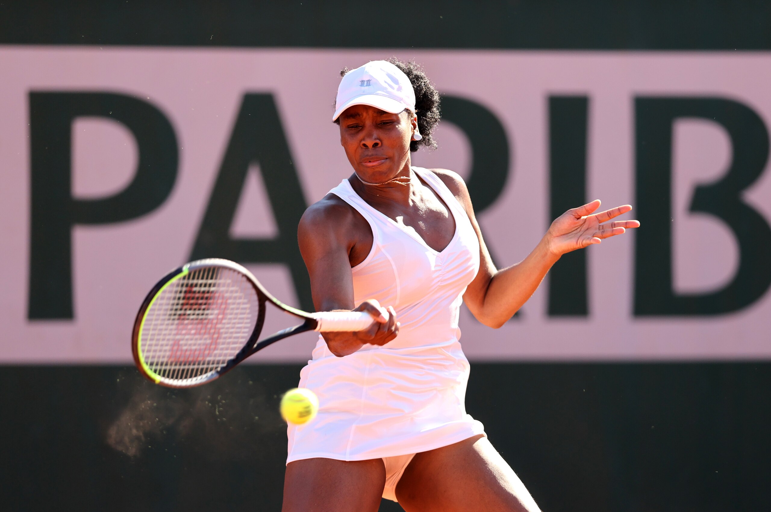 PARIS, FRANCE - JUNE 01: Venus Williams of The United States plays a forehand in their ladies first round match against Ekaterina Alexandrova of Russia during day three of the 2021 French Open at Roland Garros on June 01, 2021 in Paris, France. (Photo by Clive Brunskill/Getty Images)