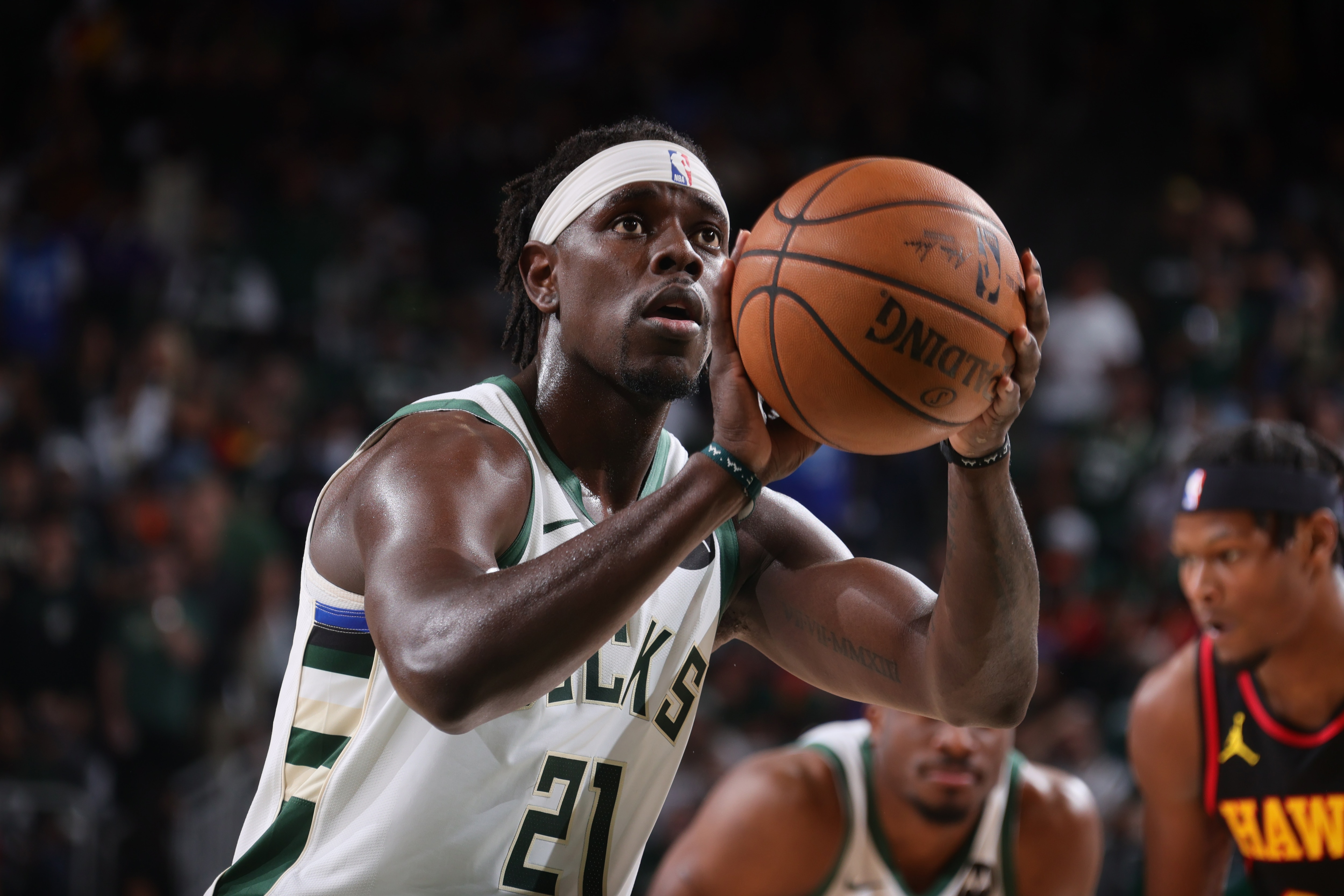 MILWAUKEE, WI - JUNE 25: Jrue Holiday #21 of the Milwaukee Bucks looks on during the game against the Atlanta Hawks during Game 1 of the Eastern Conference Finals of the 2021 NBA Playoffs on June 25, 2021 at the Fiserv Forum Center in Milwaukee, Wisconsin. NOTE TO USER: User expressly acknowledges and agrees that, by downloading and or using this Photograph, user is consenting to the terms and conditions of the Getty Images License Agreement. Mandatory Copyright Notice: Copyright 2021 NBAE (Photo by Nathaniel S. Butler/NBAE via Getty Images).