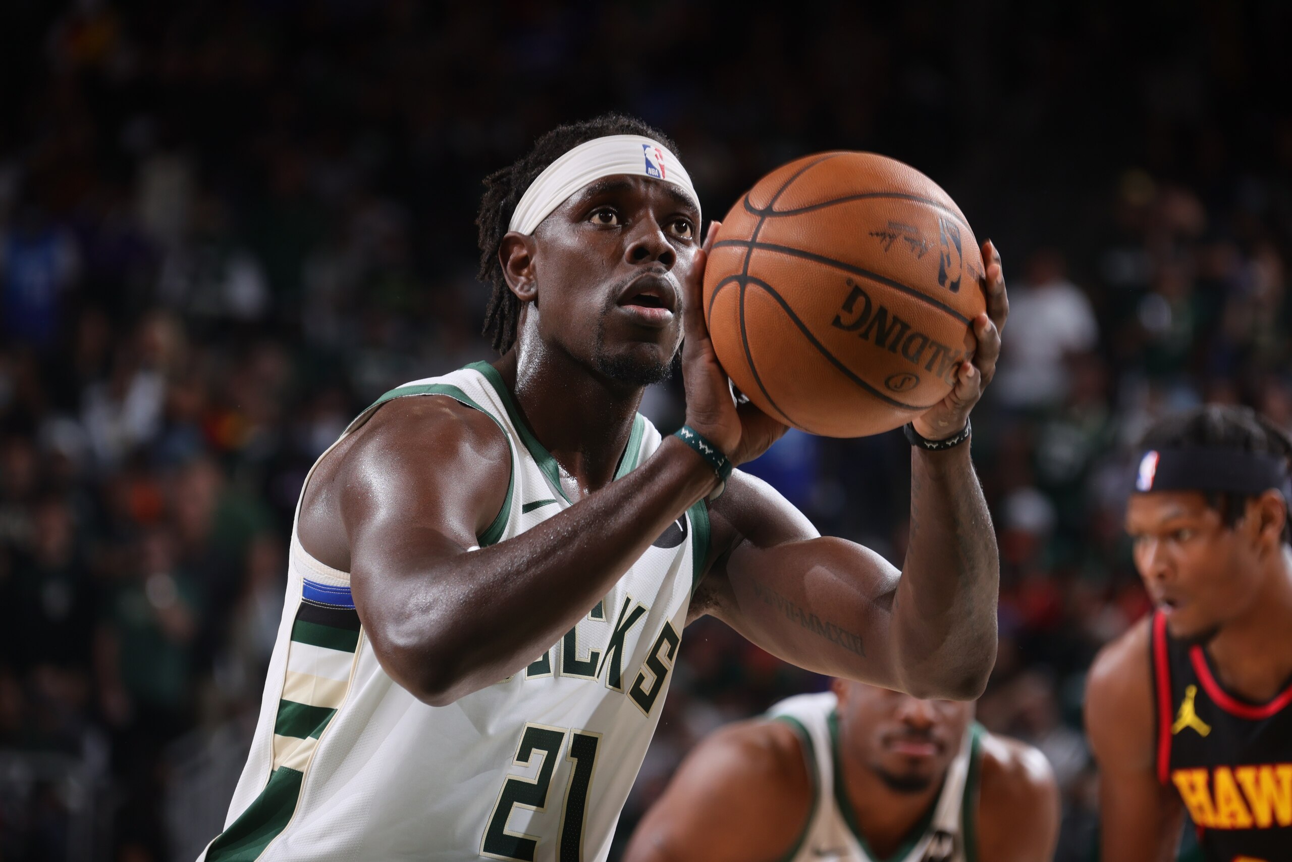 MILWAUKEE, WI - JUNE 25: Jrue Holiday #21 of the Milwaukee Bucks looks on during the game against the Atlanta Hawks during Game 1 of the Eastern Conference Finals of the 2021 NBA Playoffs on June 25, 2021 at the Fiserv Forum Center in Milwaukee, Wisconsin. NOTE TO USER: User expressly acknowledges and agrees that, by downloading and or using this Photograph, user is consenting to the terms and conditions of the Getty Images License Agreement. Mandatory Copyright Notice: Copyright 2021 NBAE (Photo by Nathaniel S. Butler/NBAE via Getty Images).