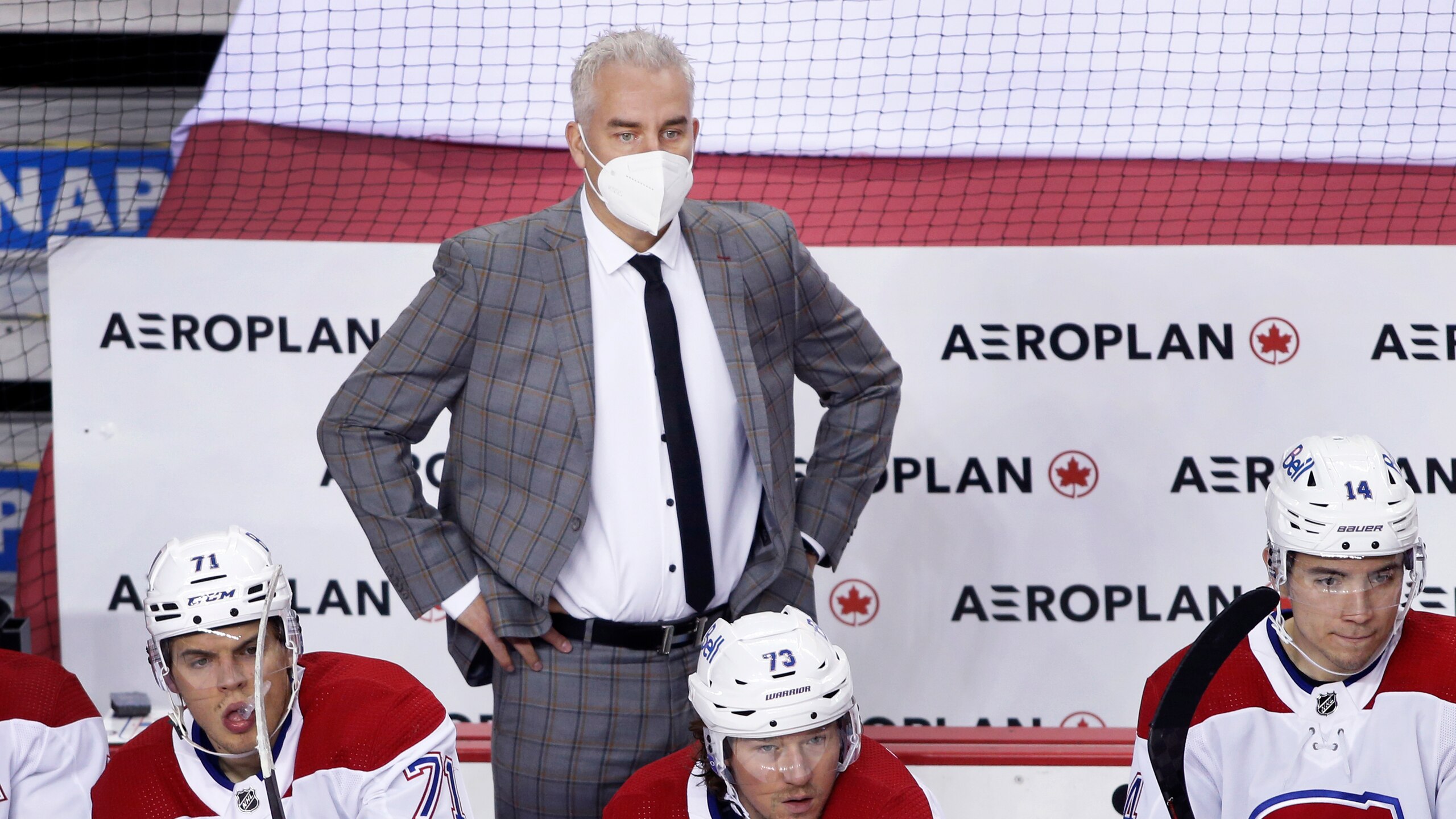 Montreal Canadiens head coach Dominique Ducharme, center, during an NHL hockey game, Thursday, March 11, 2021, in Calgary, Canada. (AP Photo/Larry MacDougal)