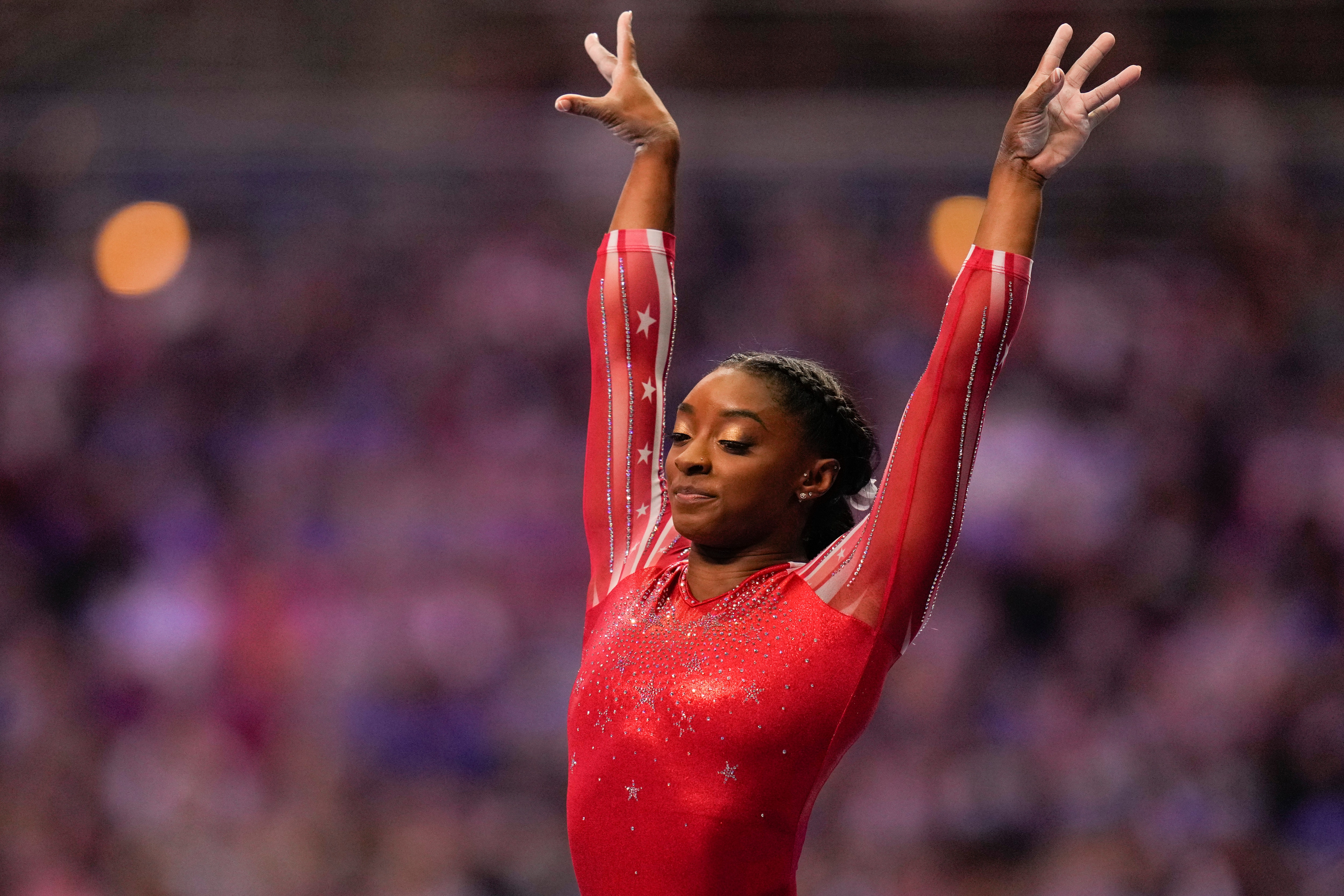 Simone Biles lands after competing on the vault during the women's U.S. Olympic Gymnastics Trials Sunday, June 27, 2021, in St. Louis. (AP Photo/Jeff Roberson)