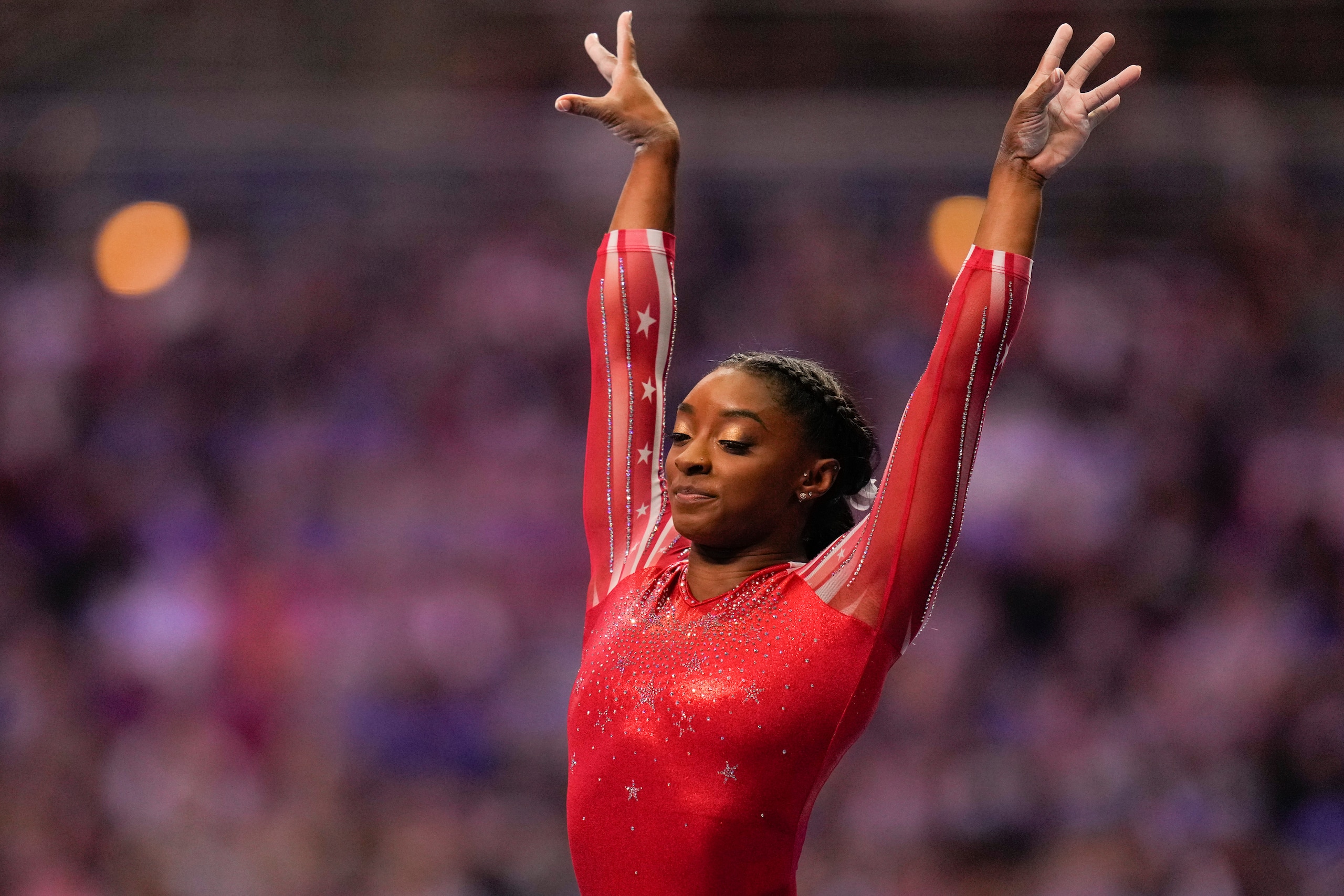 Simone Biles lands after competing on the vault during the women's U.S. Olympic Gymnastics Trials Sunday, June 27, 2021, in St. Louis. (AP Photo/Jeff Roberson)