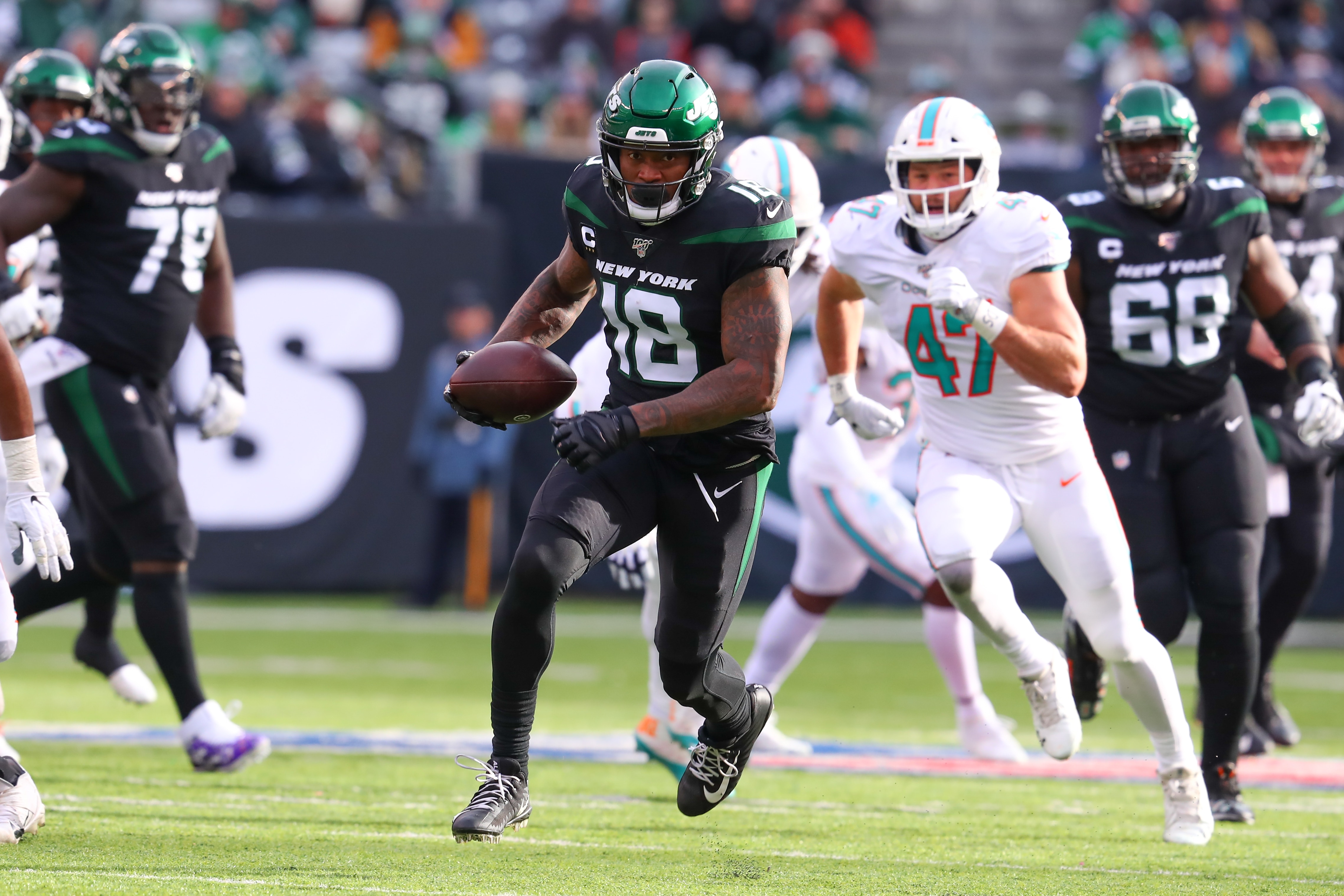 EAST RUTHERFORD, NJ - DECEMBER 08:  New York Jets wide receiver Demaryius Thomas (18)during the National Football League game between the New York Jets and the Miami Dolphins on December 8, 2019 at MetLife Stadium in East Rutherford, NJ. The call was reversed and the New York Jets were given a first down.  (Photo by Rich Graessle/Icon Sportswire via Getty Images)