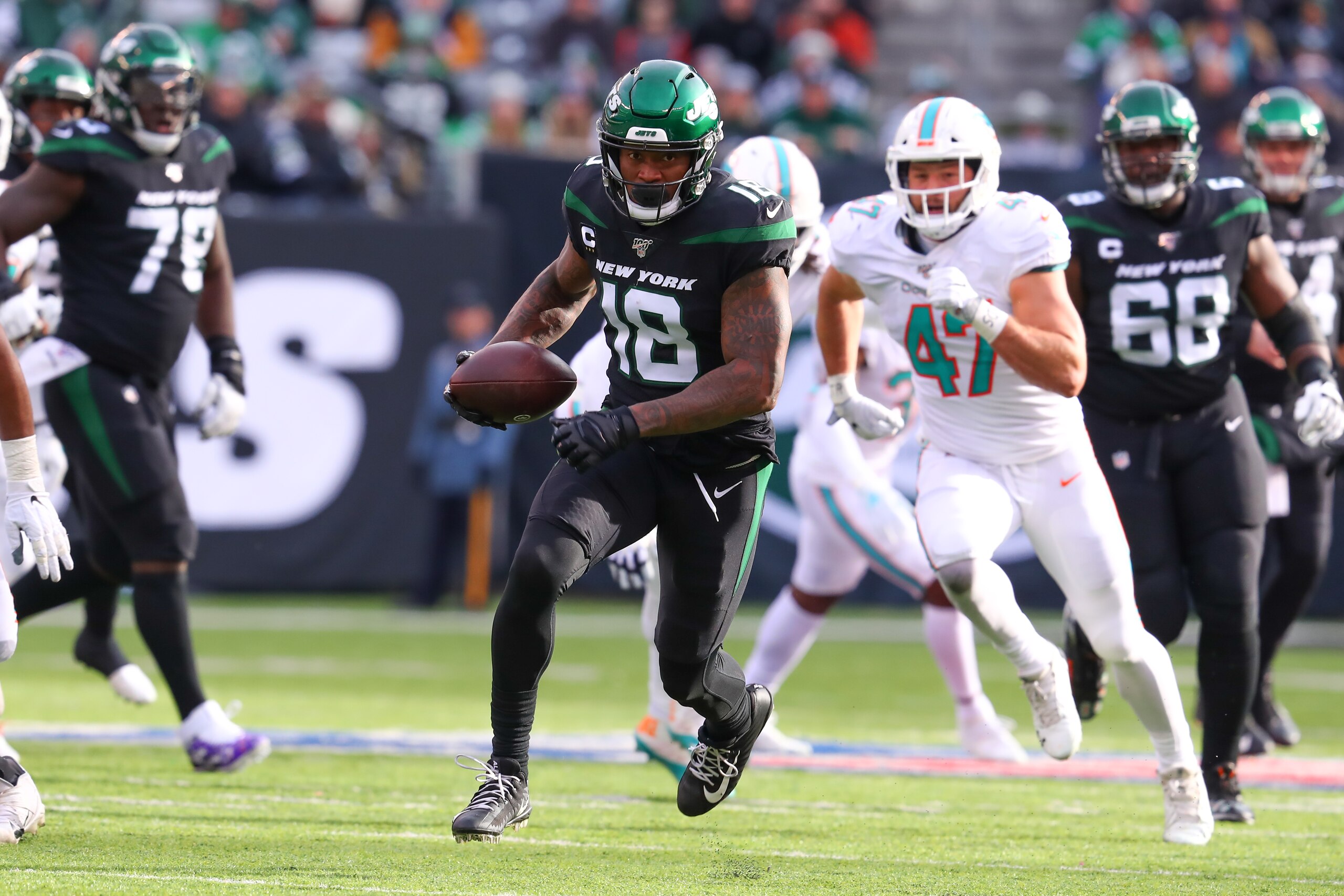EAST RUTHERFORD, NJ - DECEMBER 08:  New York Jets wide receiver Demaryius Thomas (18)during the National Football League game between the New York Jets and the Miami Dolphins on December 8, 2019 at MetLife Stadium in East Rutherford, NJ. The call was reversed and the New York Jets were given a first down.  (Photo by Rich Graessle/Icon Sportswire via Getty Images)