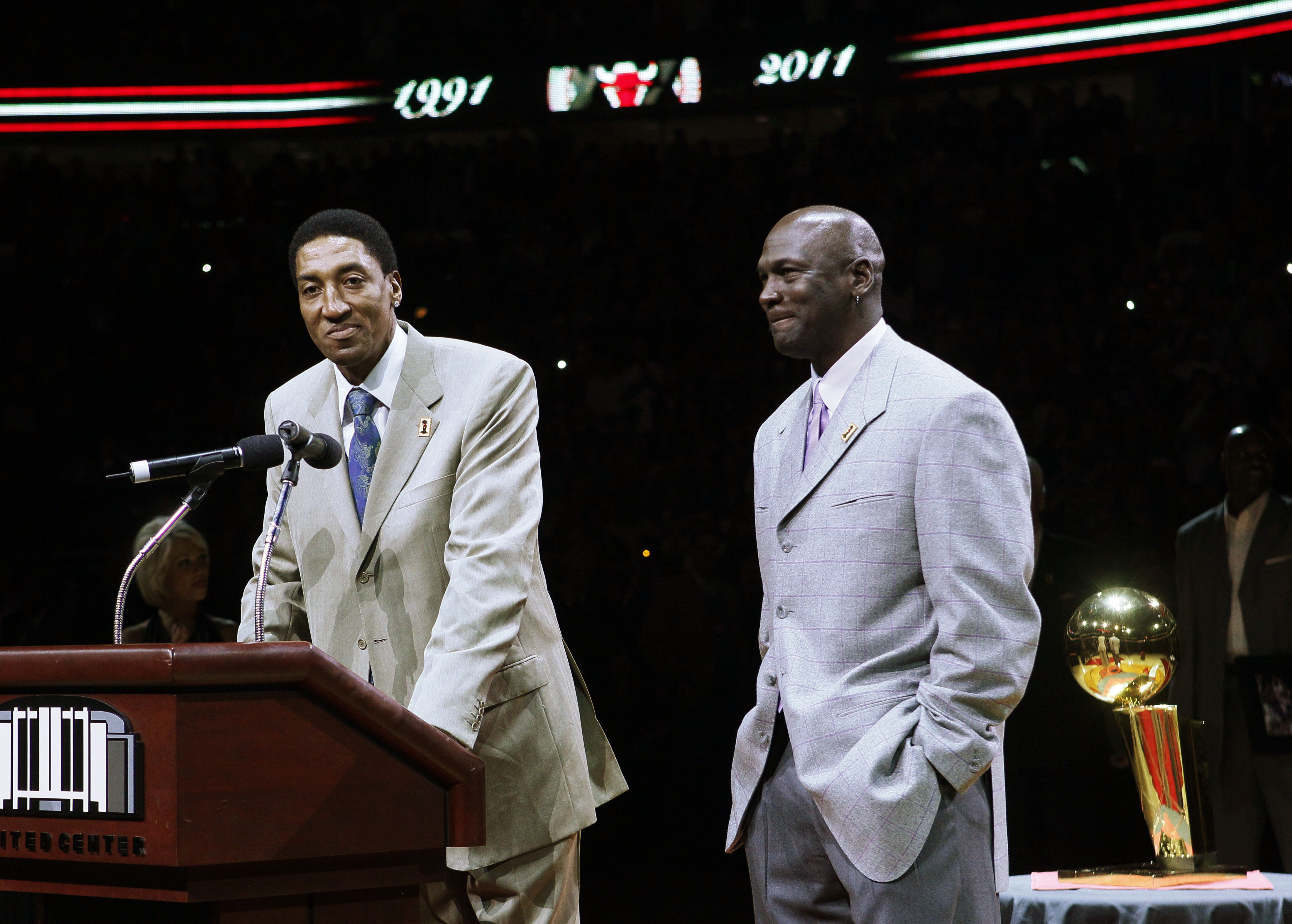 In this photo taken Saturday, March 12, 2011, former Chicago Bull Scottie Pippen, left, addresses the crowd with Michael Jordan, as teammates from their 1990-91 season celebrate the 20th anniversary of the Bulls' first NBA championship, during halftime of an NBA game against the Bulls and Utah Jazz   in Chicago. (AP Photo/Charles Rex Arbogast)