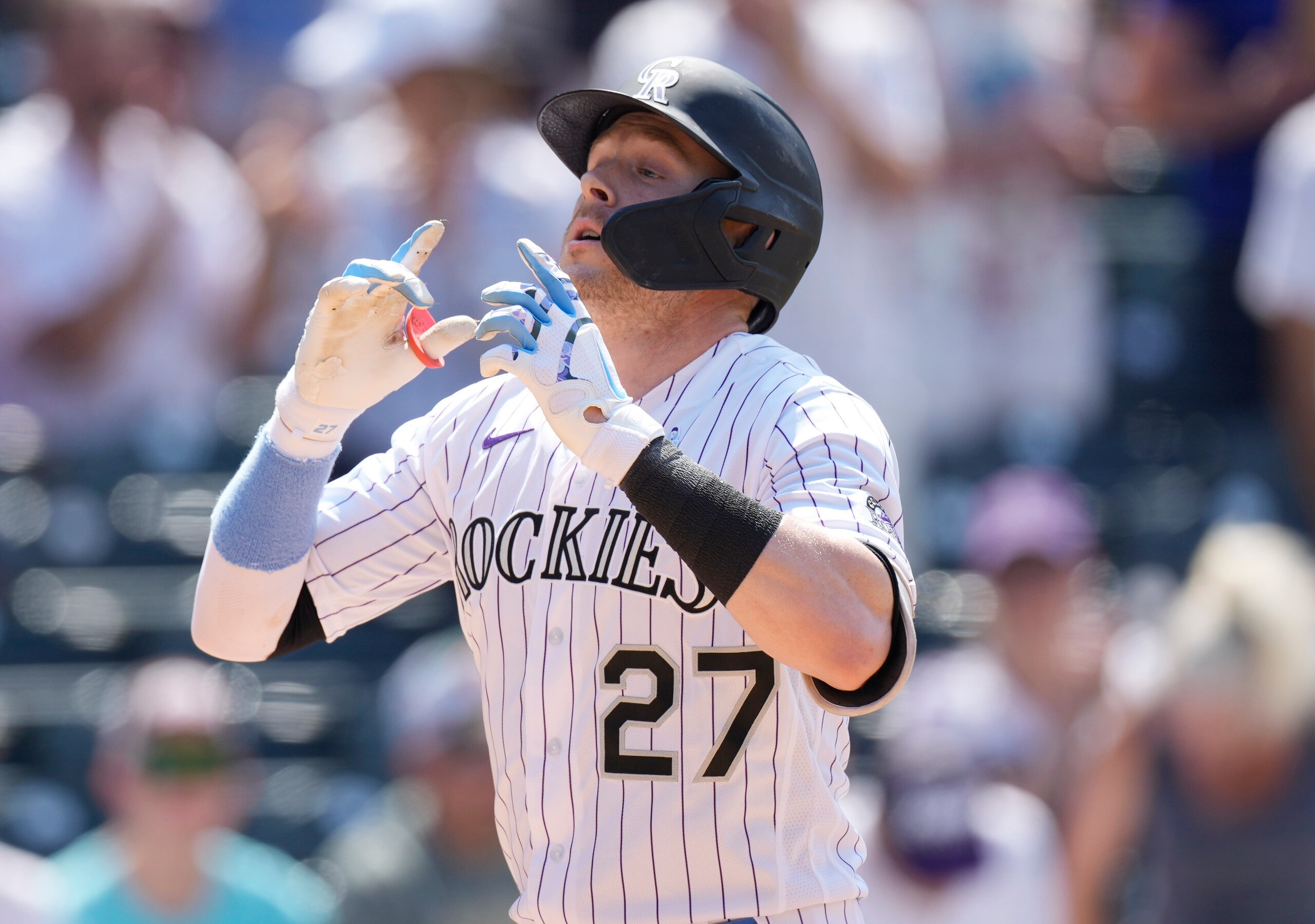 Colorado Rockies' Trevor Story gestures as he crosses home plate after hitting a solo home run off Milwaukee Brewers starting pitcher Eric Lauer in the sixth inning of a baseball game Sunday, June 20, 2021, in Denver. (AP Photo/David Zalubowski) Colorado Rockies' Trevor Story gestures as he crosses home plate after hitting a solo home run off Milwaukee Brewers starting pitcher Eric Lauer in the sixth inning of a baseball game Sunday, June 20, 2021, in Denver. (AP Photo/David Zalubowski)