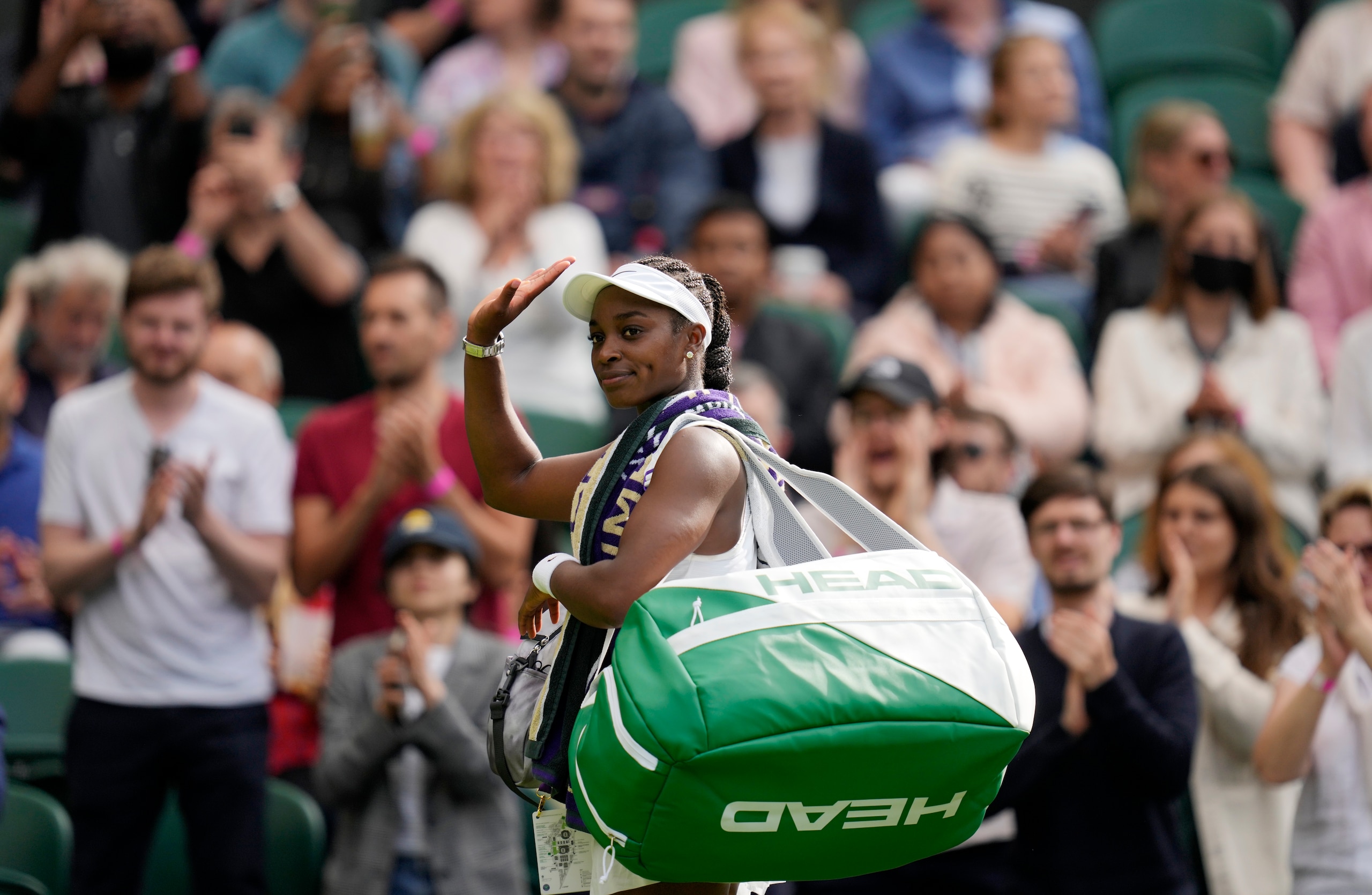 Sloane Stephens of the US leaves the court after winning the women's singles match against Czech Republic's Petra Kvitova on day one of the Wimbledon Tennis Championships in London, Monday June 28, 2021. (AP Photo/Kirsty Wigglesworth)