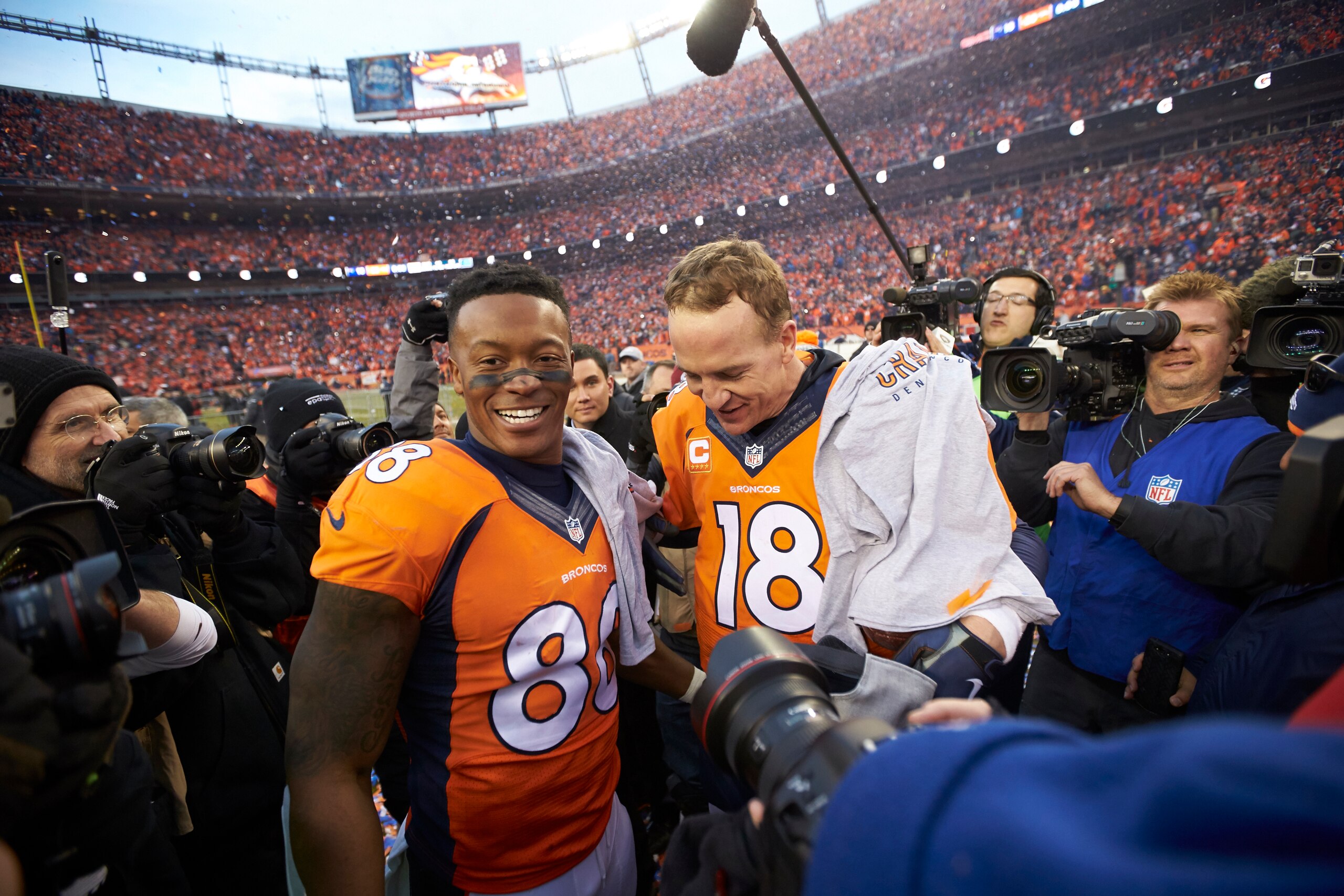 Football: AFC Playoffs: Denver Broncos QB Peyton Manning (18) with Demaryius Thomas (88) after winning game vs New Engalnd Patriots at Sports Authority Field at Mile High.
Denver, CO 1/24/2016
CREDIT: Jeff Haynes (Photo by Jeff Haynes /Sports Illustrated via Getty Images)
(Set Number: SI-188 TK1 )