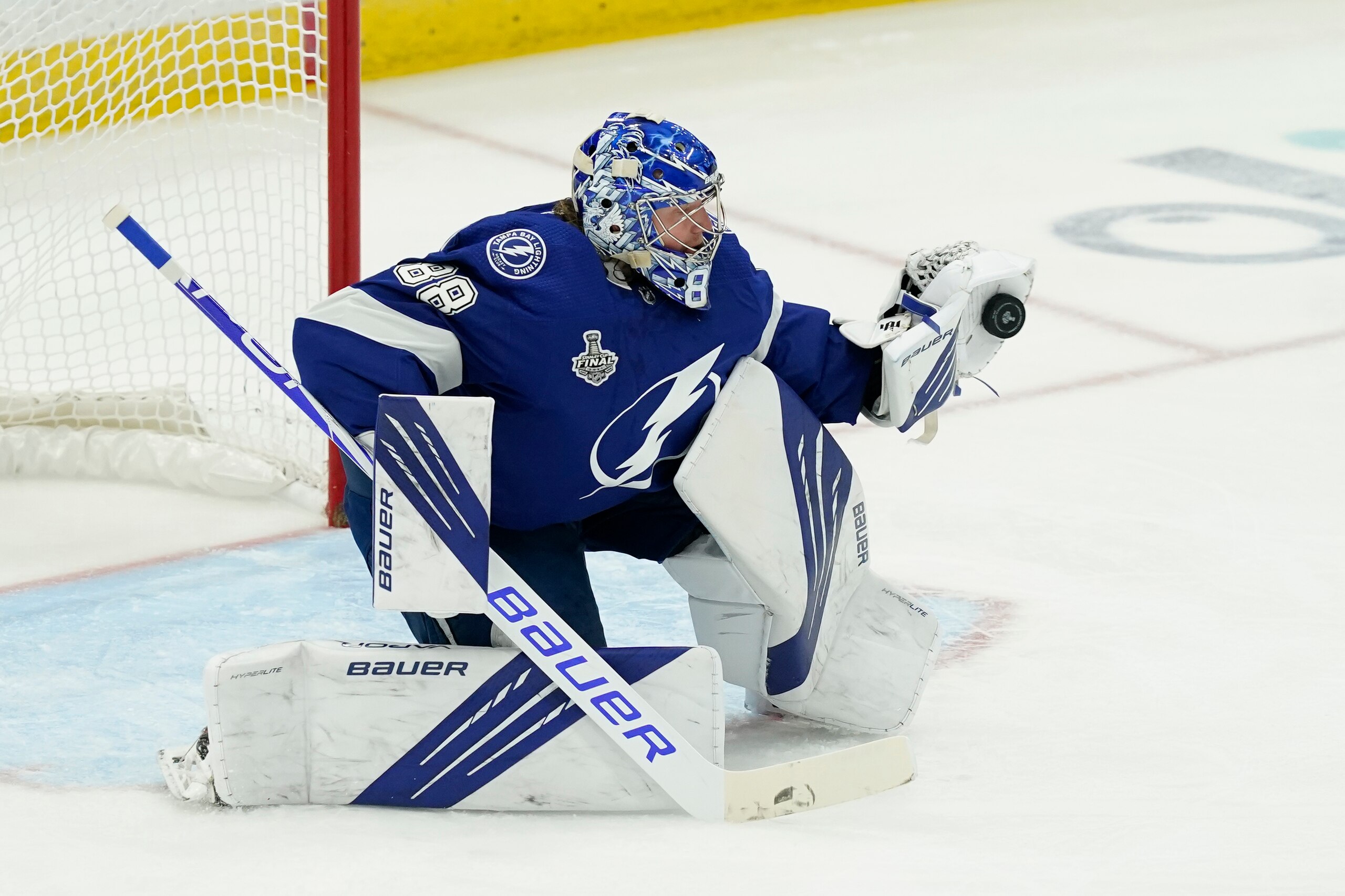 Tampa Bay Lightning goaltender Andrei Vasilevskiy blocks a shot during the second period in Game 1 of the NHL hockey Stanley Cup finals against the Montreal Canadiens, Monday, June 28, 2021, in Tampa, Fla. (AP Photo/Gerry Broome)
