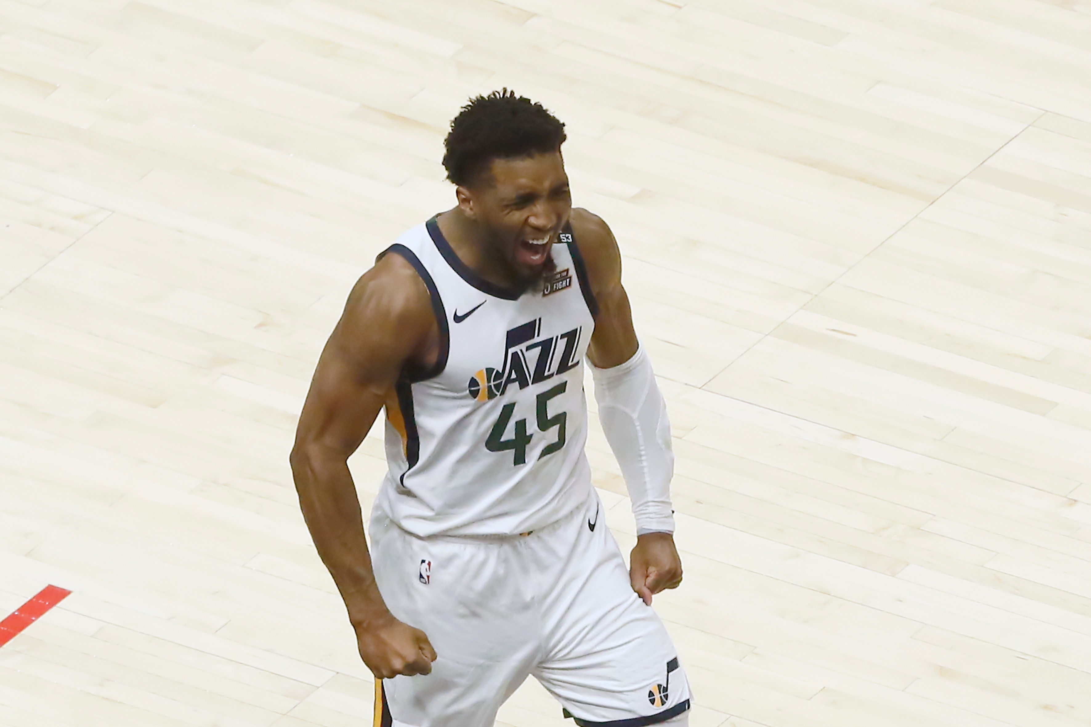 LOS ANGELES, CA - JUNE 18: Donovan Mitchell #45 of the Utah Jazz celebrates against the LA Clippers during Round 2, Game 6 of the 2021 NBA Playoffs on June 18, 2021 at STAPLES Center in Los Angeles, California. NOTE TO USER: User expressly acknowledges and agrees that, by downloading and/or using this Photograph, user is consenting to the terms and conditions of the Getty Images License Agreement. Mandatory Copyright Notice: Copyright 2021 NBAE (Photo by Chris Elise/NBAE via Getty Images)