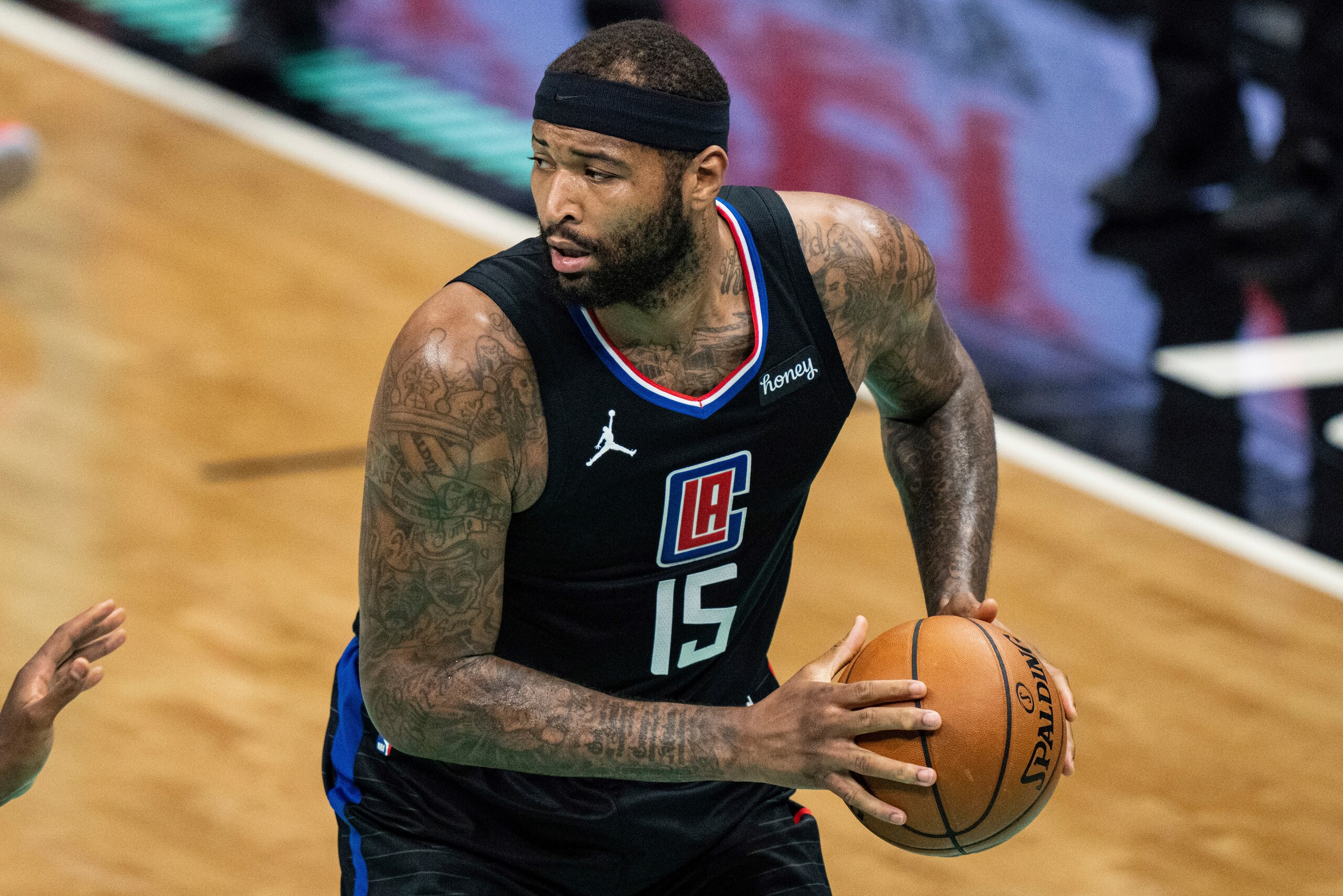 Los Angeles Clippers center DeMarcus Cousins (15) brings the ball up court against the Charlotte Hornets during an NBA basketball game in Charlotte, N.C., Thursday, May 13, 2021. (AP Photo/Jacob Kupferman)