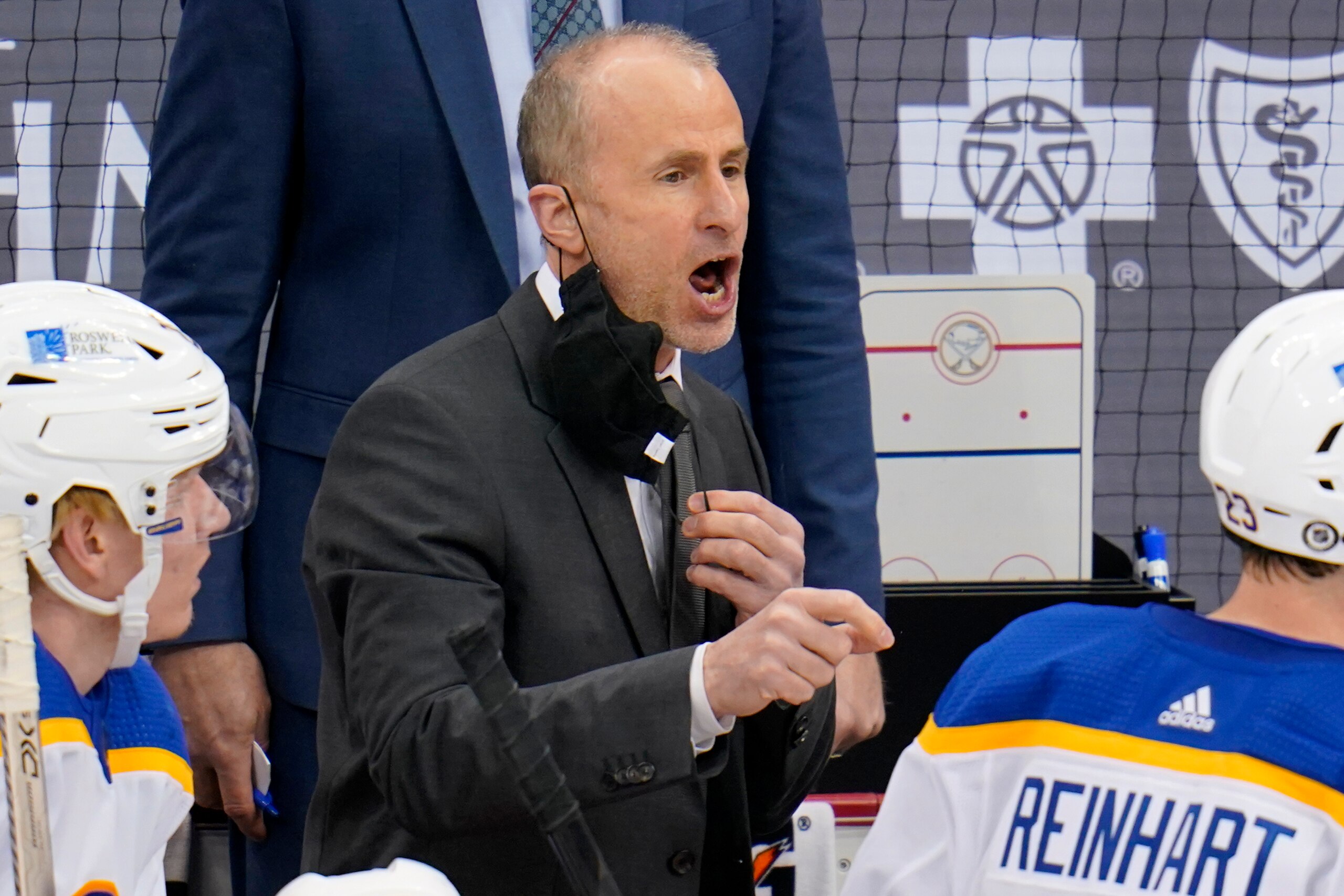 Buffalo Sabres head coach Don Granato gives instructions during the third period of an NHL hockey game against the Pittsburgh Penguins in Pittsburgh, Saturday, May 8, 2021. The Penguins won 1-0.(AP Photo/Gene J. Puskar)