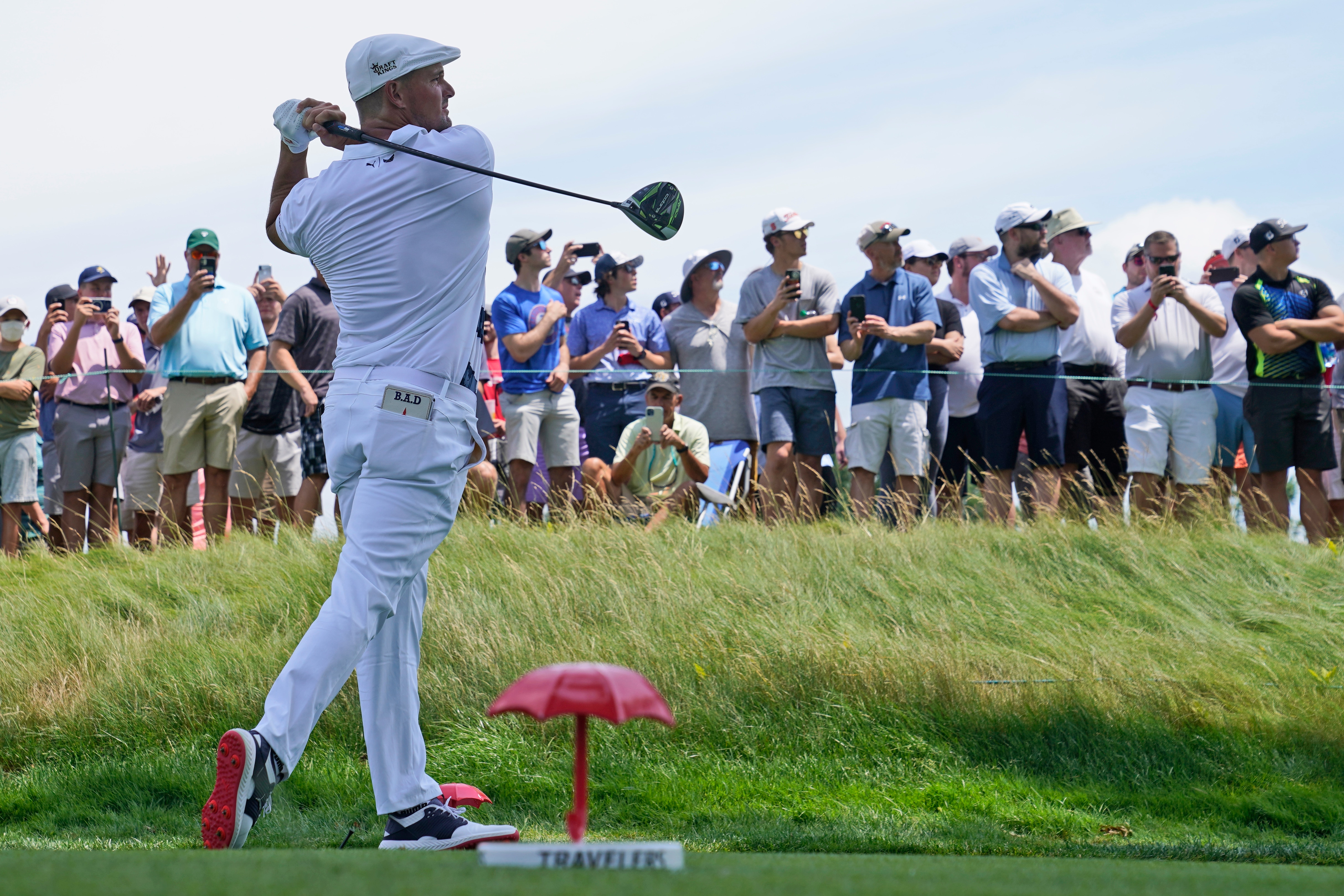 Bryson DeChambeau watches his tee shot on the third tee during the final round of the Travelers Championship golf tournament at TPC River Highlands, Sunday, June 27, 2021, in Cromwell, Conn. (AP Photo/John Minchillo)