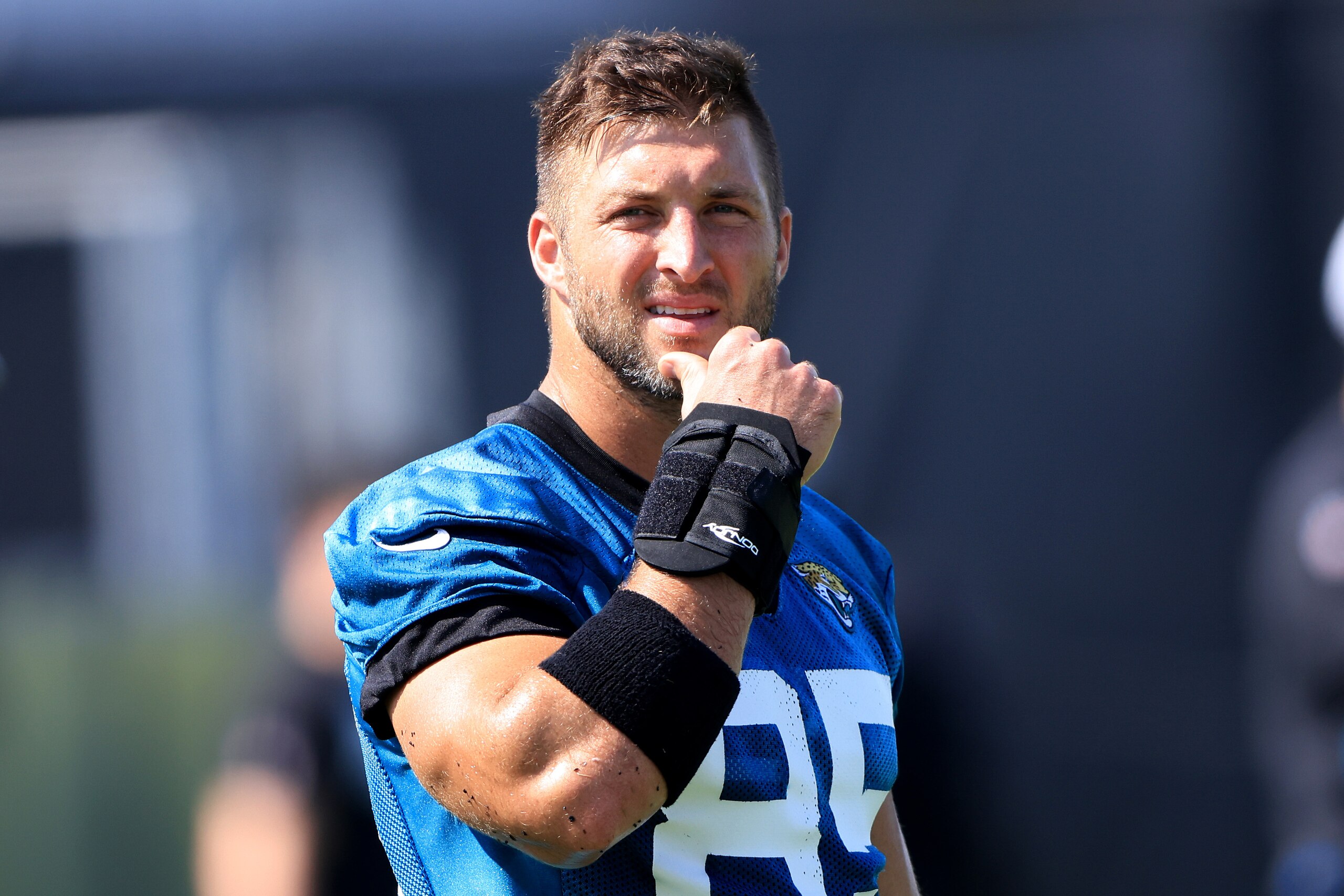 JACKSONVILLE, FLORIDA - JUNE 15: Tim Tebow #85 of the Jacksonville Jaguars watches the action during Jacksonville Jaguars Mandatory Minicamp at TIAA Bank Field on June 15, 2021 in Jacksonville, Florida. (Photo by Sam Greenwood/Getty Images)
