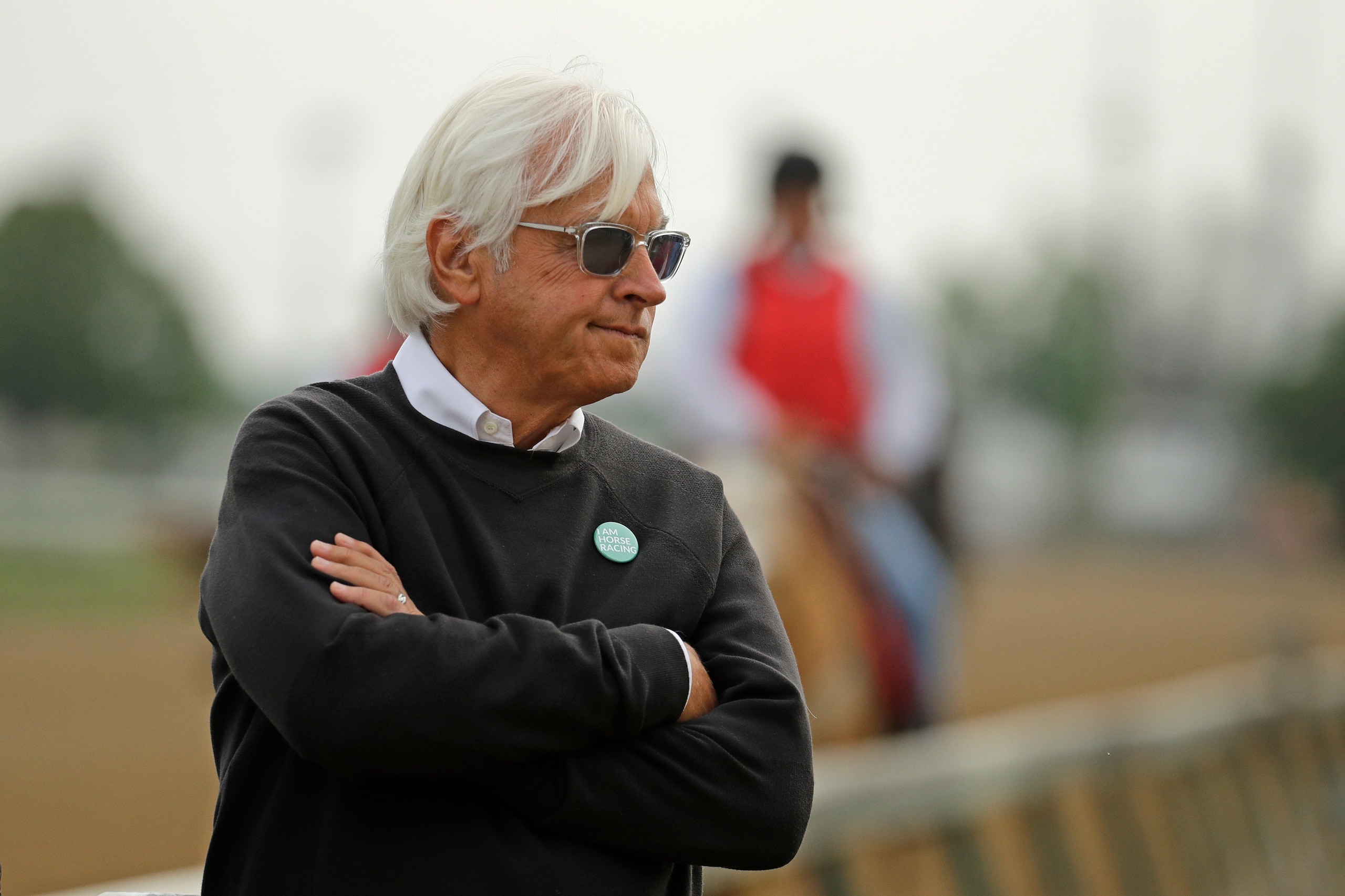FILE  - In this May 1, 2019, file photo, trainer Bob Baffert watches his Kentucky Derby entrant Game Winner during a workout at Churchill Downs in Louisville, Ky. Two-time Triple Crown-winning trainer Bob Baffert, who has had multiple horses test positive in post-race drug testing, is taking steps to “do better,” including hiring outside oversight. Baffert said in a statement Wednesday, Nov. 4, 2020, that he is “very aware” of the incidents involving his horses and the impact that it's had on his family, the sport and himself. (AP Photo/Charlie Riedel)