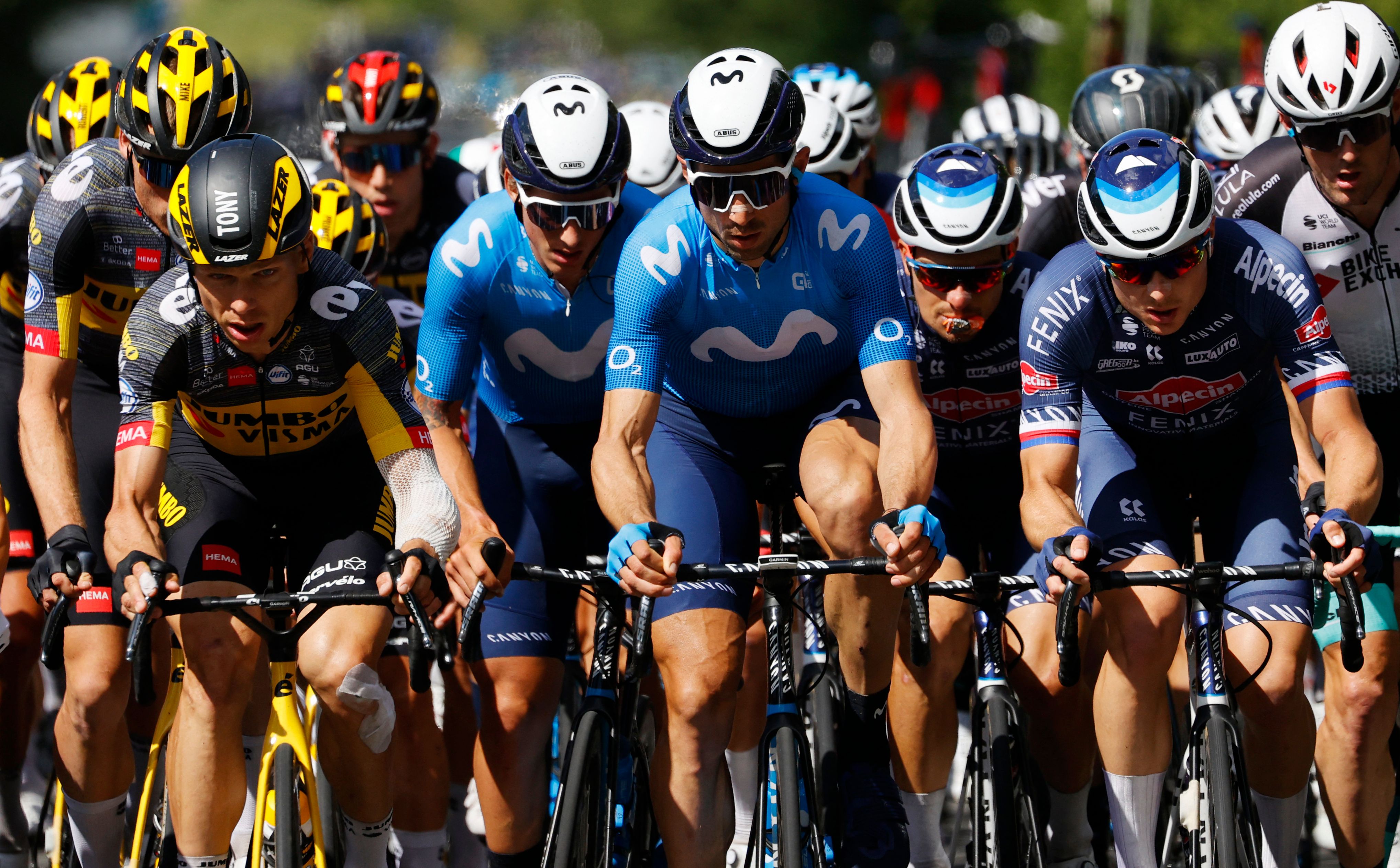Team Jumbo Visma's Tony Martin of Germany (L) rides with the pack during the 2nd stage of the 108th edition of the Tour de France cycling race, 183 km between Perros-Guirrec and Mur de Bretagne Guerledan, on June 27, 2021. (Photo by Thomas SAMSON / AFP) (Photo by THOMAS SAMSON/AFP via Getty Images)