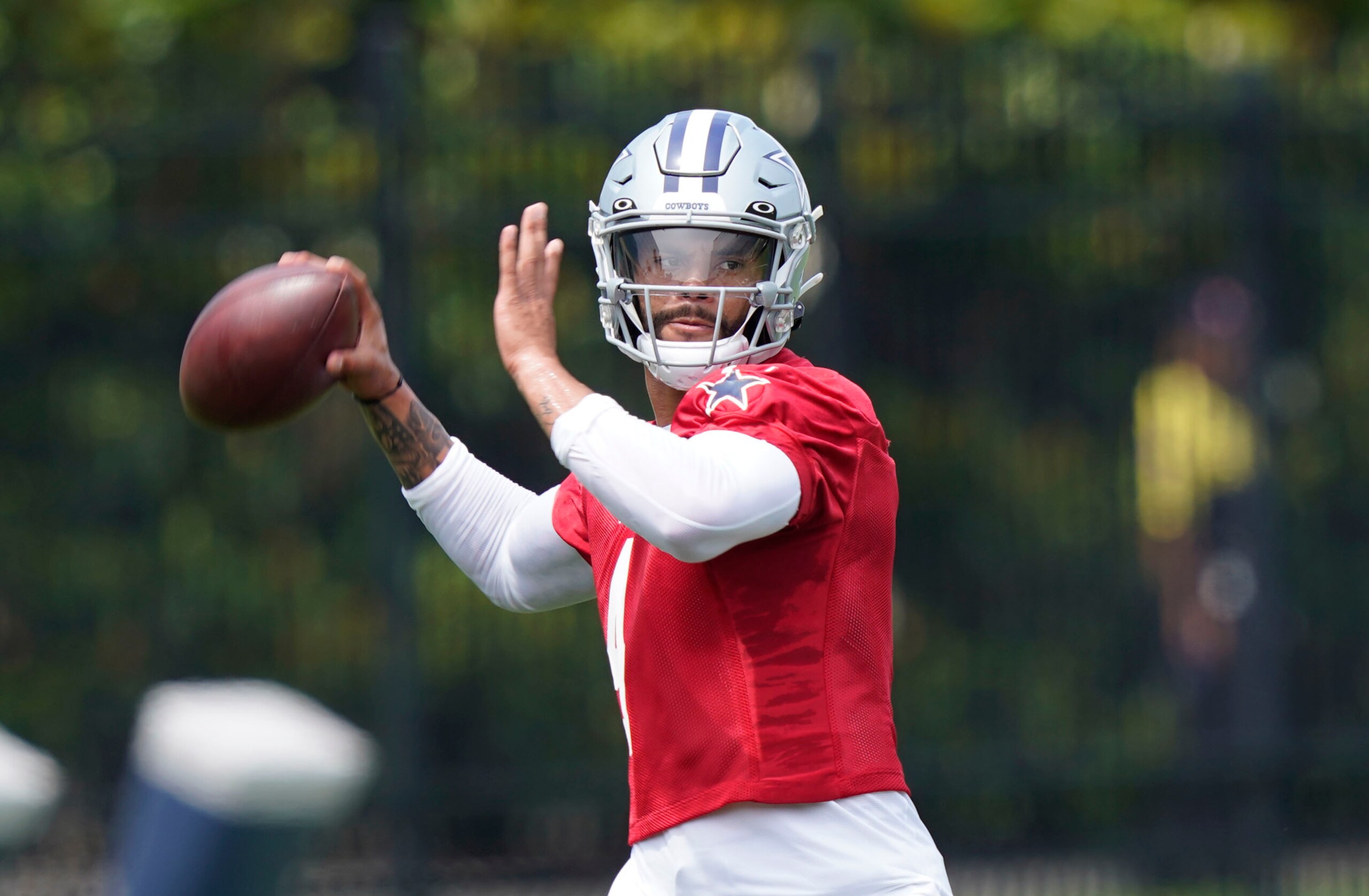 Dallas Cowboys quarterback Dak Prescott looks to pass during an NFL football team practice Tuesday, June 8, 2021, in Frisco, Texas. (AP Photo/LM Otero)