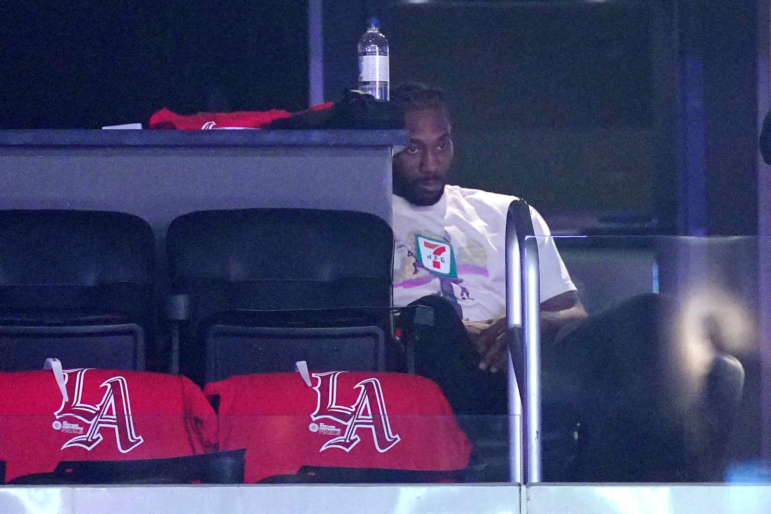 Los Angeles Clippers forward Kawhi Leonard sits in a suite during the first half in Game 4 of the NBA basketball Western Conference Finals against the Phoenix Suns Saturday, June 26, 2021, in Los Angeles. (AP Photo/Mark J. Terrill)
