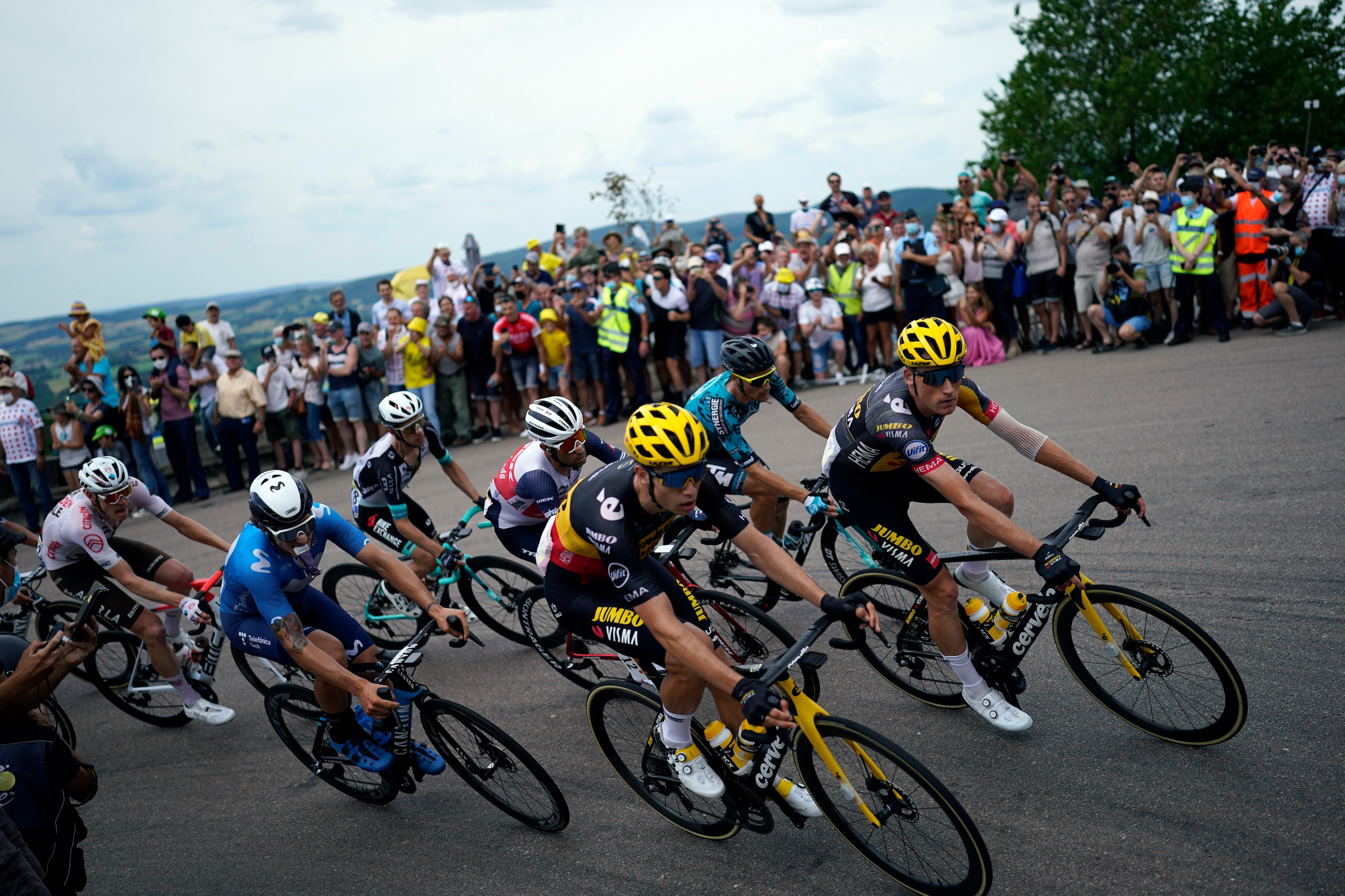 Belgium's Wout Van Aert, foreground center, rides with the breakaway group during the seventh stage of the Tour de France cycling race over 249.1 kilometers (154.8 miles) with start in Vierzon and finish in Le Creusot, France, Friday, July 2, 2021. (AP Photo/Daniel Cole)