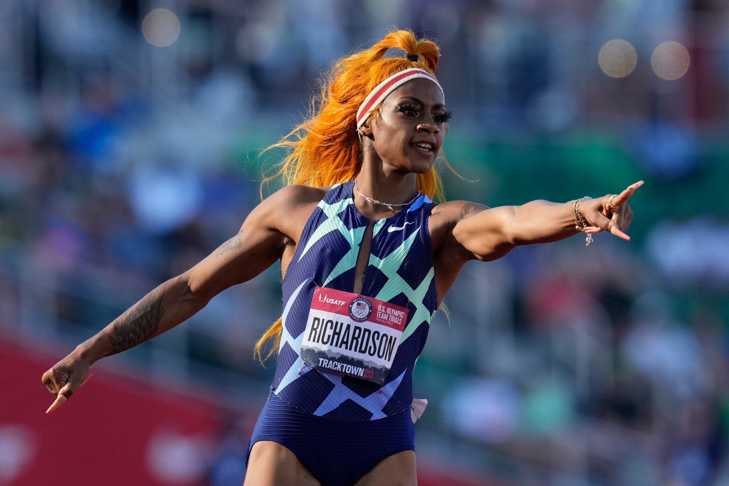 Sha'Carri Richardson celebrates after winning the first heat of the semis finals in women's 100-meter runat the U.S. Olympic Track and Field Trials Saturday, June 19, 2021, in Eugene, Ore. (AP Photo/Ashley Landis)