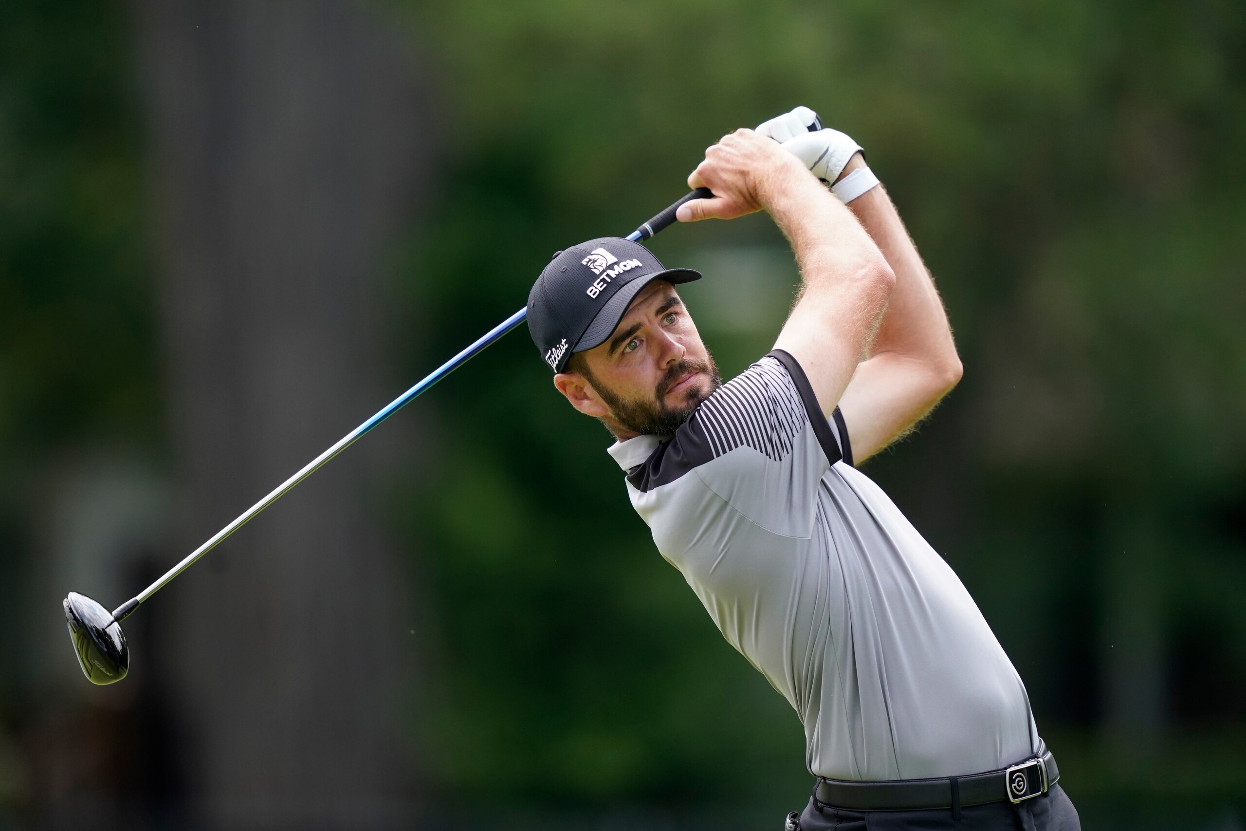 Troy Merritt drives off the fourth tee during the third round of the Rocket Mortgage Classic golf tournament, Saturday, July 3, 2021, at the Detroit Golf Club in Detroit. (AP Photo/Carlos Osorio)