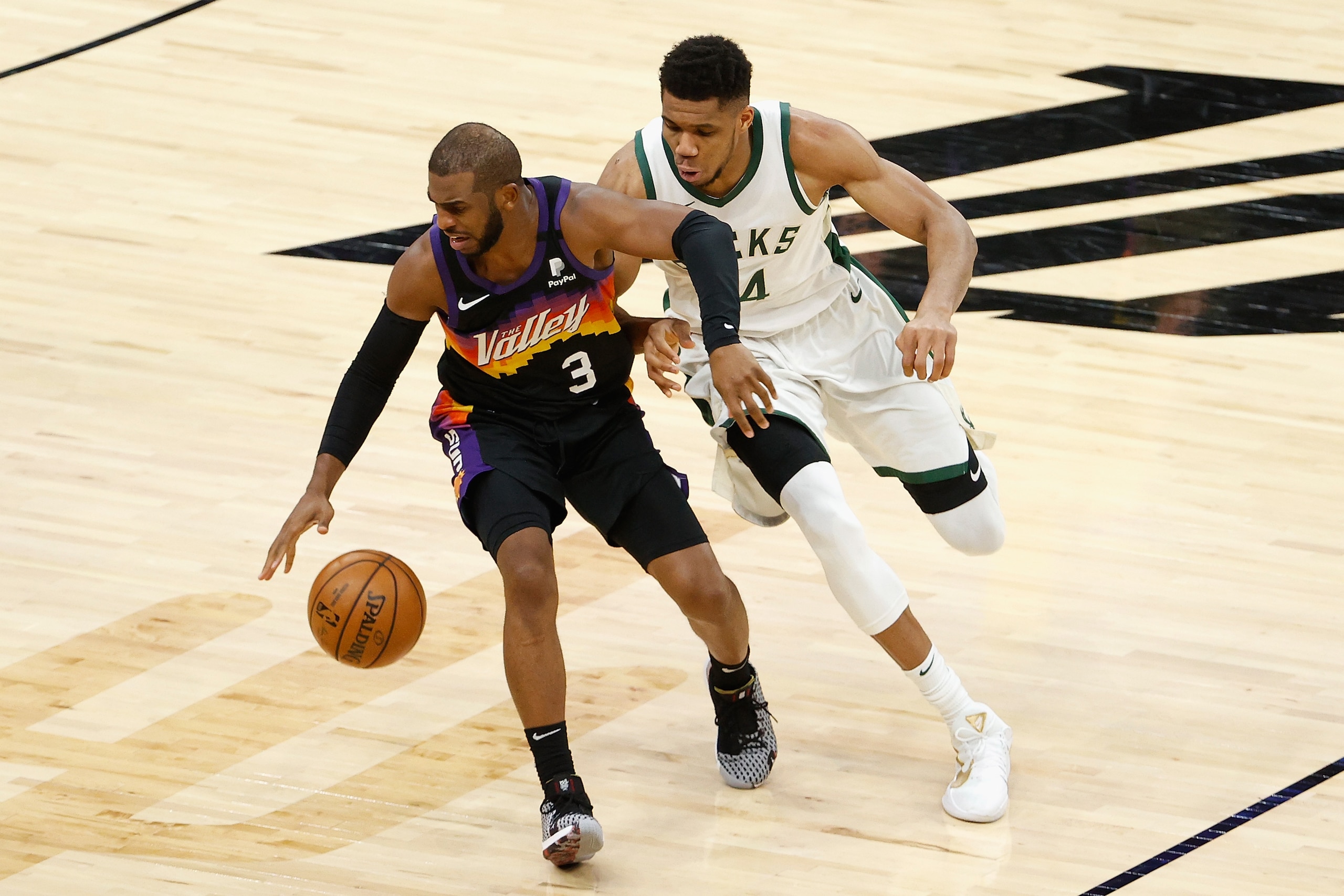 PHOENIX, ARIZONA - FEBRUARY 10: Chris Paul #3 of the Phoenix Suns handle the ball against Giannis Antetokounmpo #34 of the Milwaukee Bucks during the second half of the NBA game at Phoenix Suns Arena on February 10, 2021 in Phoenix, Arizona. The Suns defeated the Bucks 125-124. NOTE TO USER: User expressly acknowledges and agrees that, by downloading and or using this photograph, User is consenting to the terms and conditions of the Getty Images License Agreement. (Photo by Christian Petersen/Getty Images) PHOENIX, ARIZONA - FEBRUARY 10: Chris Paul #3 of the Phoenix Suns handle the ball against Giannis Antetokounmpo #34 of the Milwaukee Bucks during the second half of the NBA game at Phoenix Suns Arena on February 10, 2021 in Phoenix, Arizona. The Suns defeated the Bucks 125-124. NOTE TO USER: User expressly acknowledges and agrees that, by downloading and or using this photograph, User is consenting to the terms and conditions of the Getty Images License Agreement. (Photo by Christian Petersen/Getty Images)