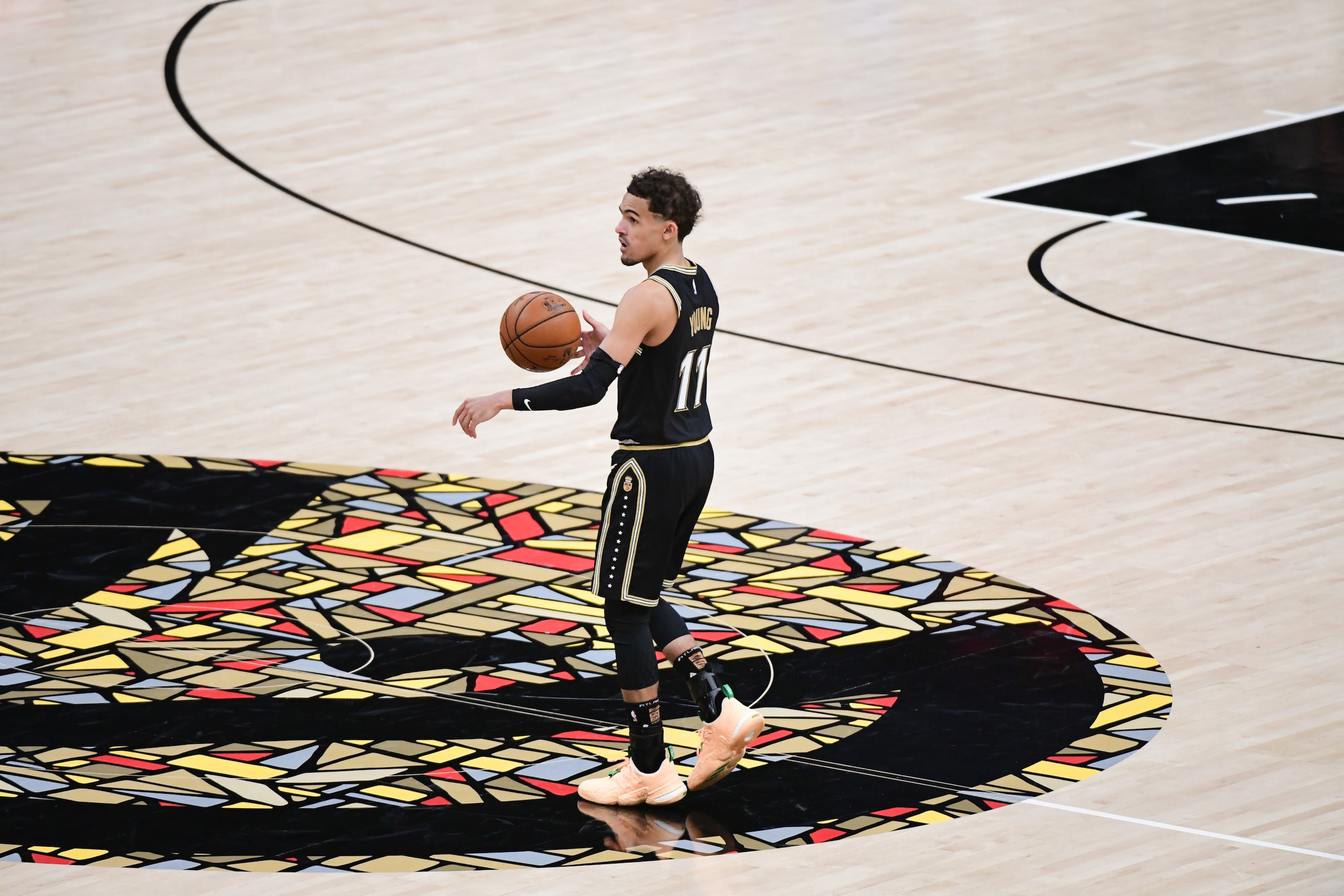 ATLANTA, GA - JULY 3: Trae Young #11 of the Atlanta Hawks handles the ball during the game against the Milwaukee Bucks during Game 6 of the Eastern Conference Finals of the 2021 NBA Playoffs on July 3, 2021 at State Farm Arena in Atlanta, Georgia.  NOTE TO USER: User expressly acknowledges and agrees that, by downloading and/or using this Photograph, user is consenting to the terms and conditions of the Getty Images License Agreement. Mandatory Copyright Notice: Copyright 2021 NBAE (Photo by Adam Hagy/NBAE via Getty Images)