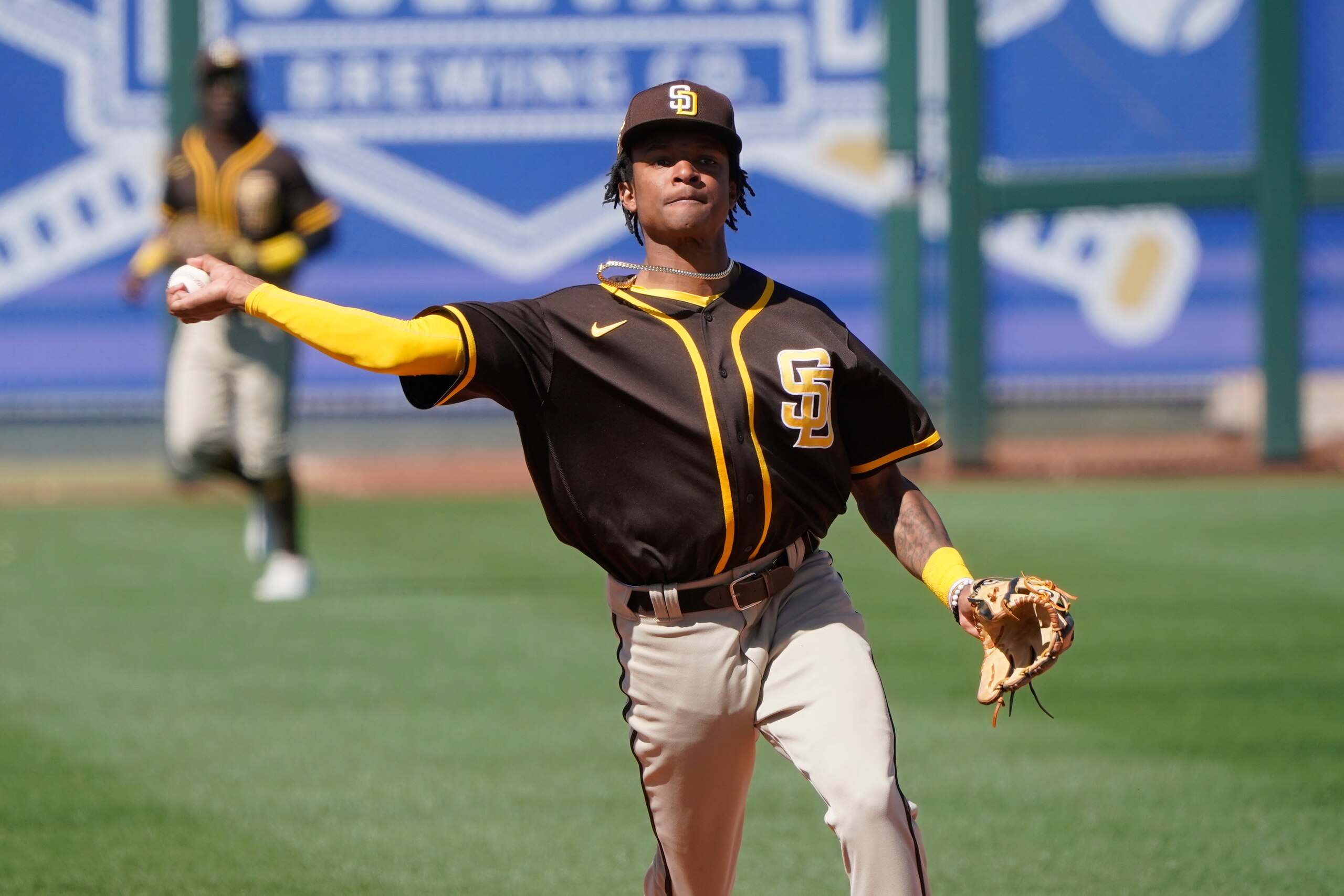 San Diego Padres shortstop CJ Abrams throws to first base during a spring training baseball game against the Kansas City Royals, Monday, March 22, 2021, in Surprise, Ariz. (AP Photo/Sue Ogrocki)