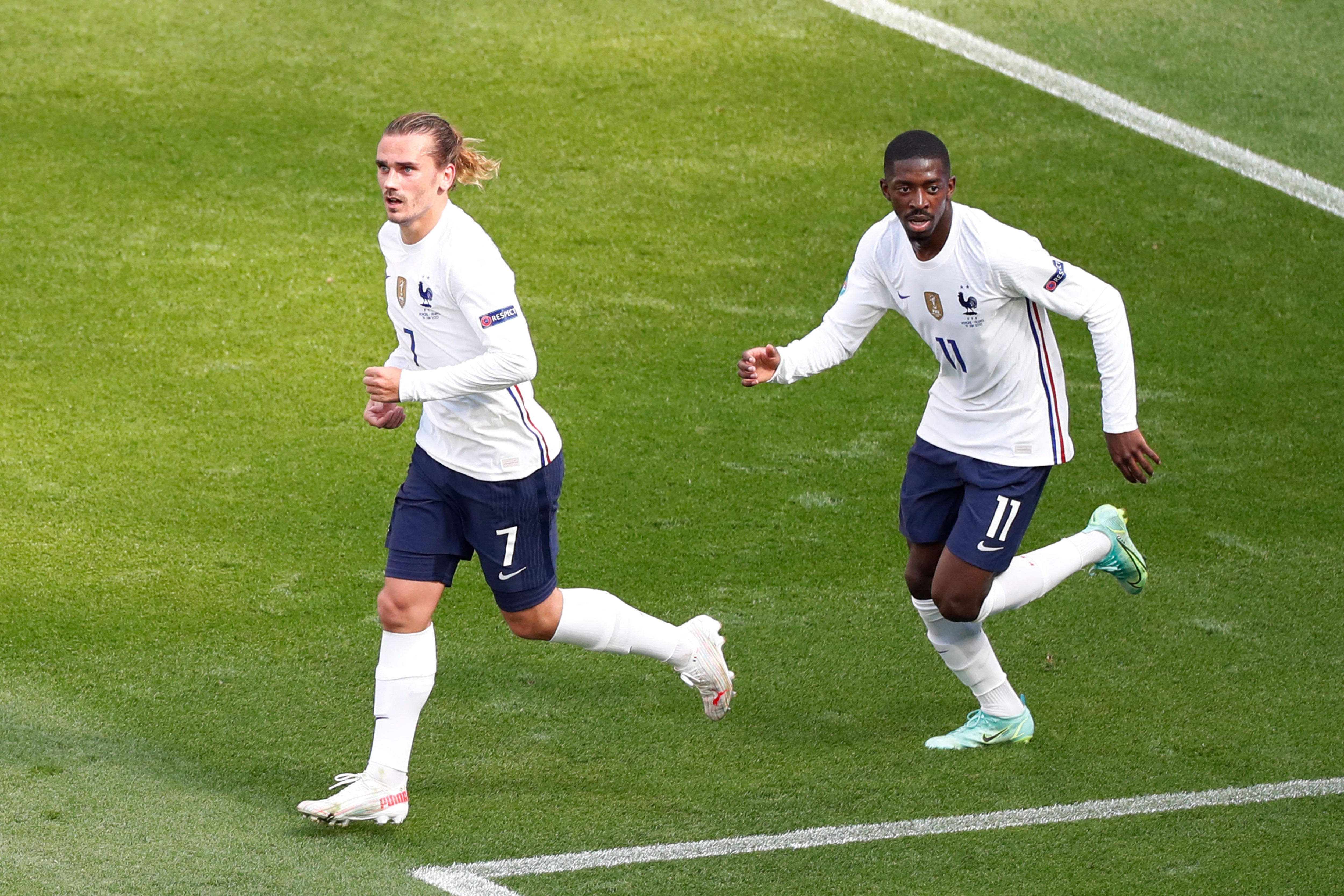 TOPSHOT - France's forward Antoine Griezmann (L) celebrates scoring his team's first goal with his teammate France's forward Ousmane Dembele during the UEFA EURO 2020 Group F football match between Hungary and France at Puskas Arena in Budapest on June 19, 2021. (Photo by Laszlo Balogh / POOL / AFP) (Photo by LASZLO BALOGH/POOL/AFP via Getty Images)