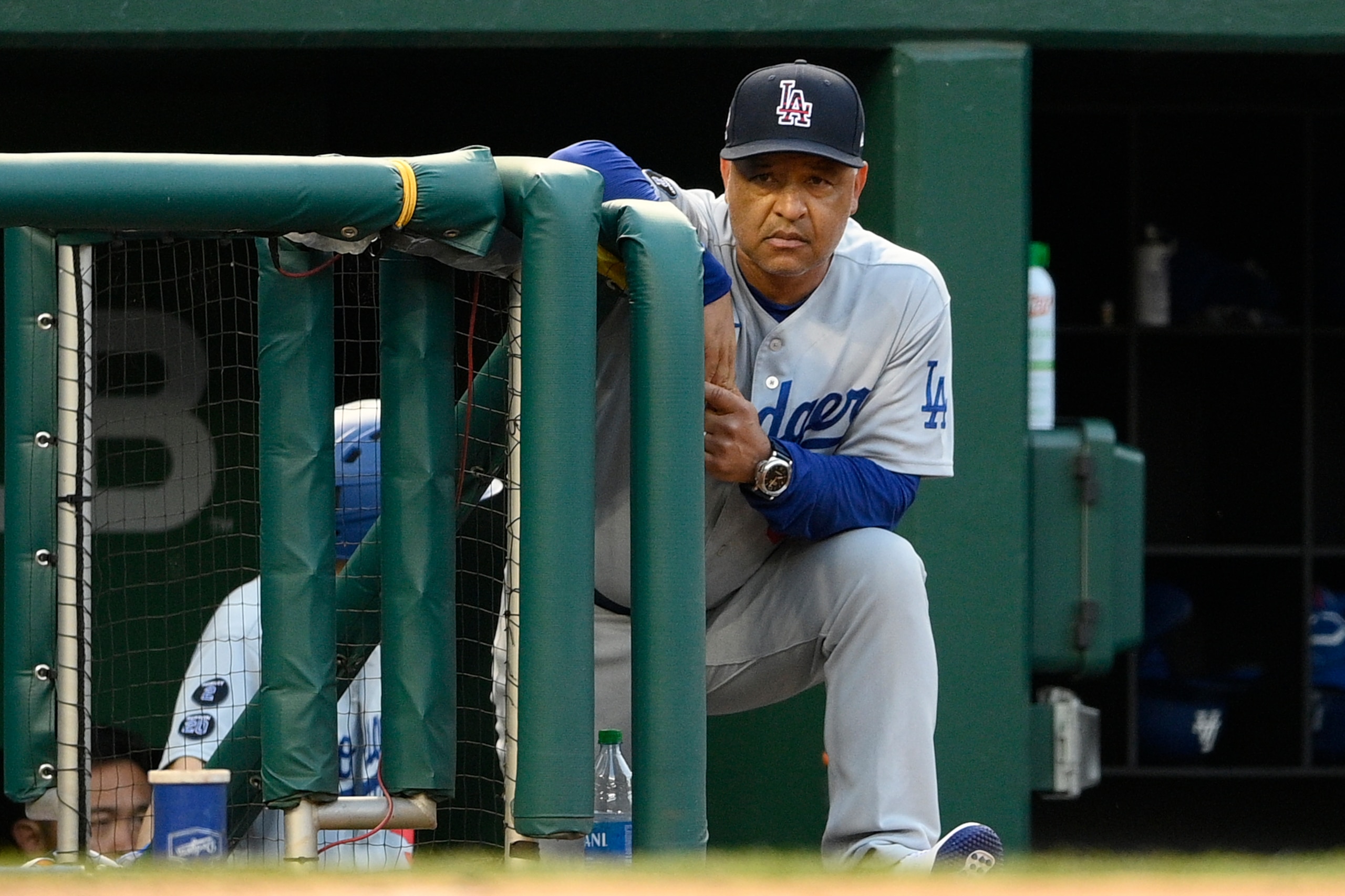 Los Angeles Dodgers manager Dave Roberts watches during a baseball game against the Washington Nationals, Saturday, July 3, 2021, in Washington. (AP Photo/Nick Wass)